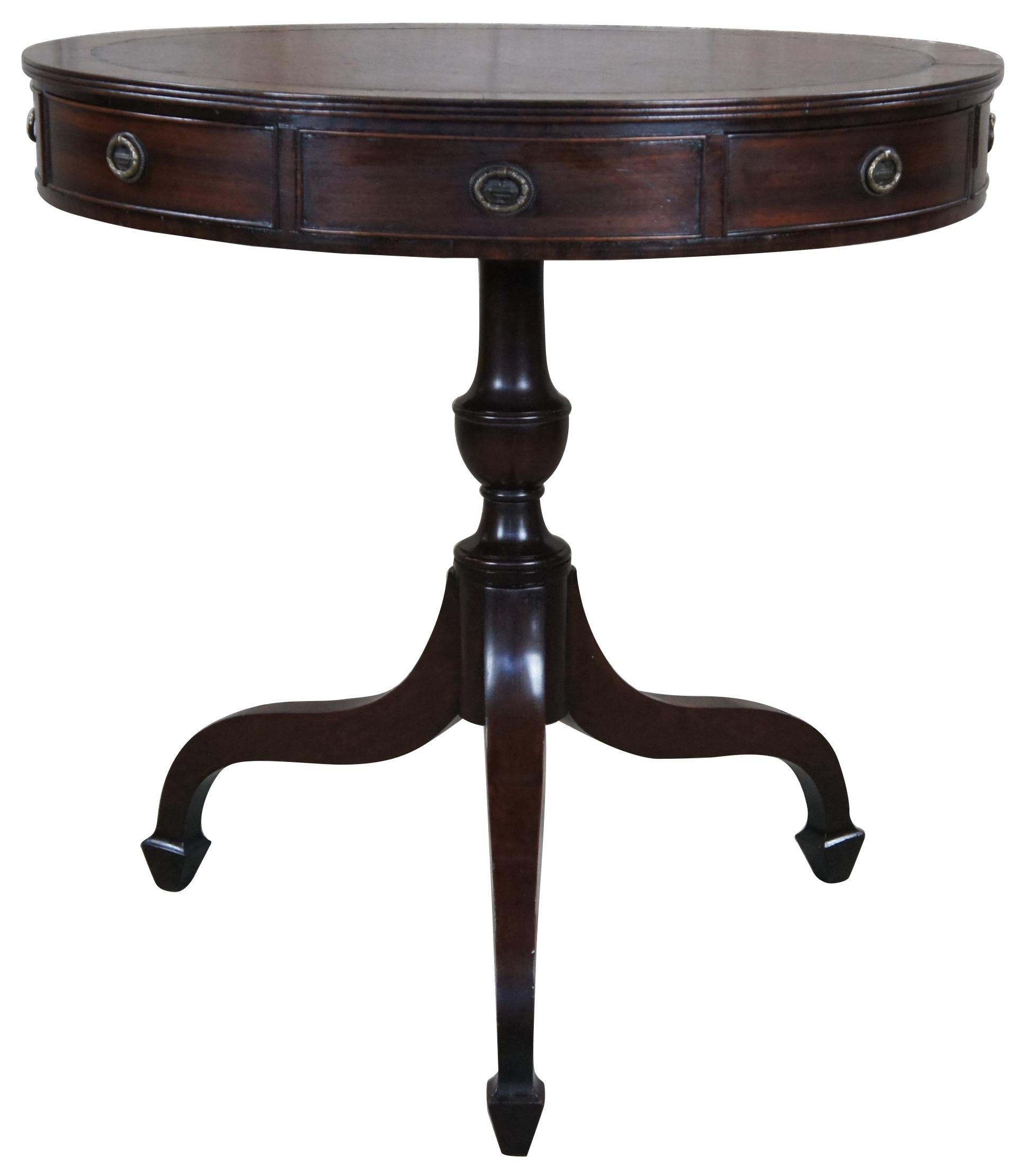 Mid 19th century English Regency rent table. The rent table was an early filing system for land lords. It generally consisted of a drum table with several drawers that were used to keep and collect rent as well as hold papers pertaining to their