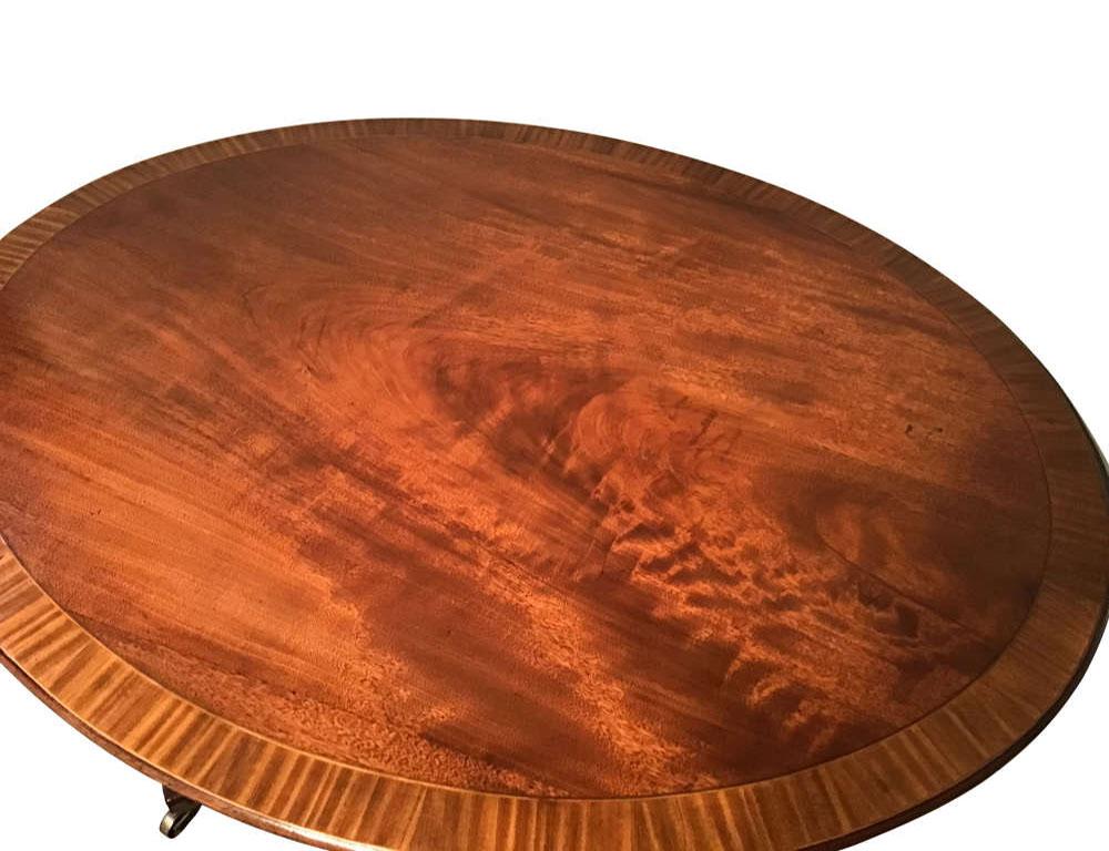 Antique English regency oval mahogany and satinwood breakfast table.