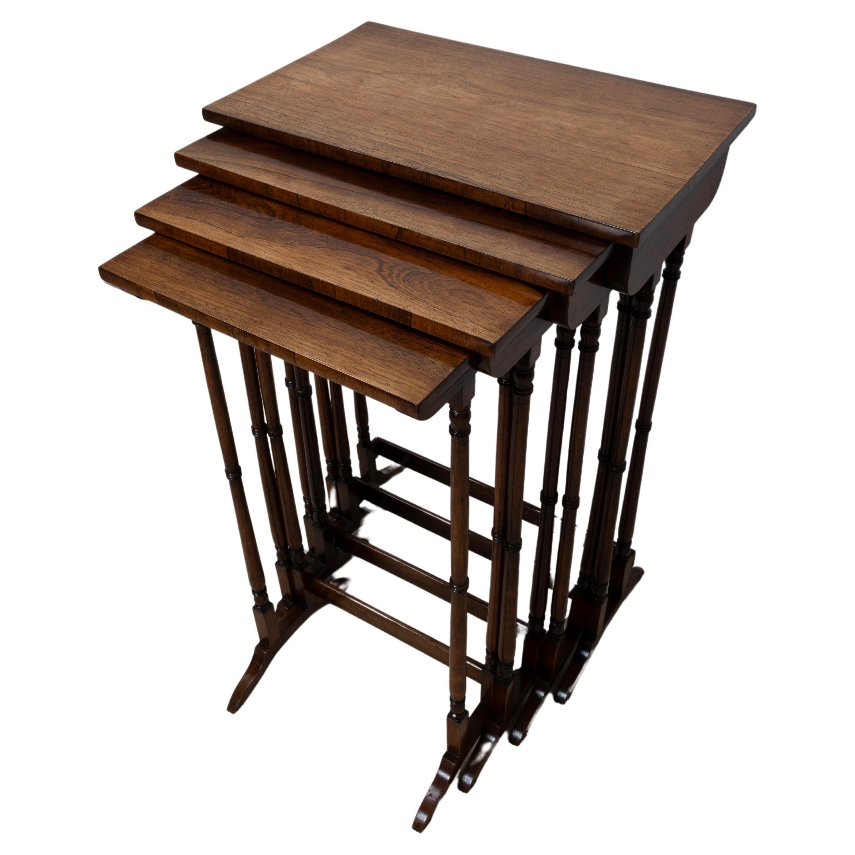 A REGENCY NEST OF ROSEWOOD QUARTETTO TABLES
EARLY 19TH CENTURY C.1820
Each of graduated size, on turned supports and splayed feet, joined by a stretcher
The cabinet maker George Smith stated that such tables were ‘placed in the drawing room so the