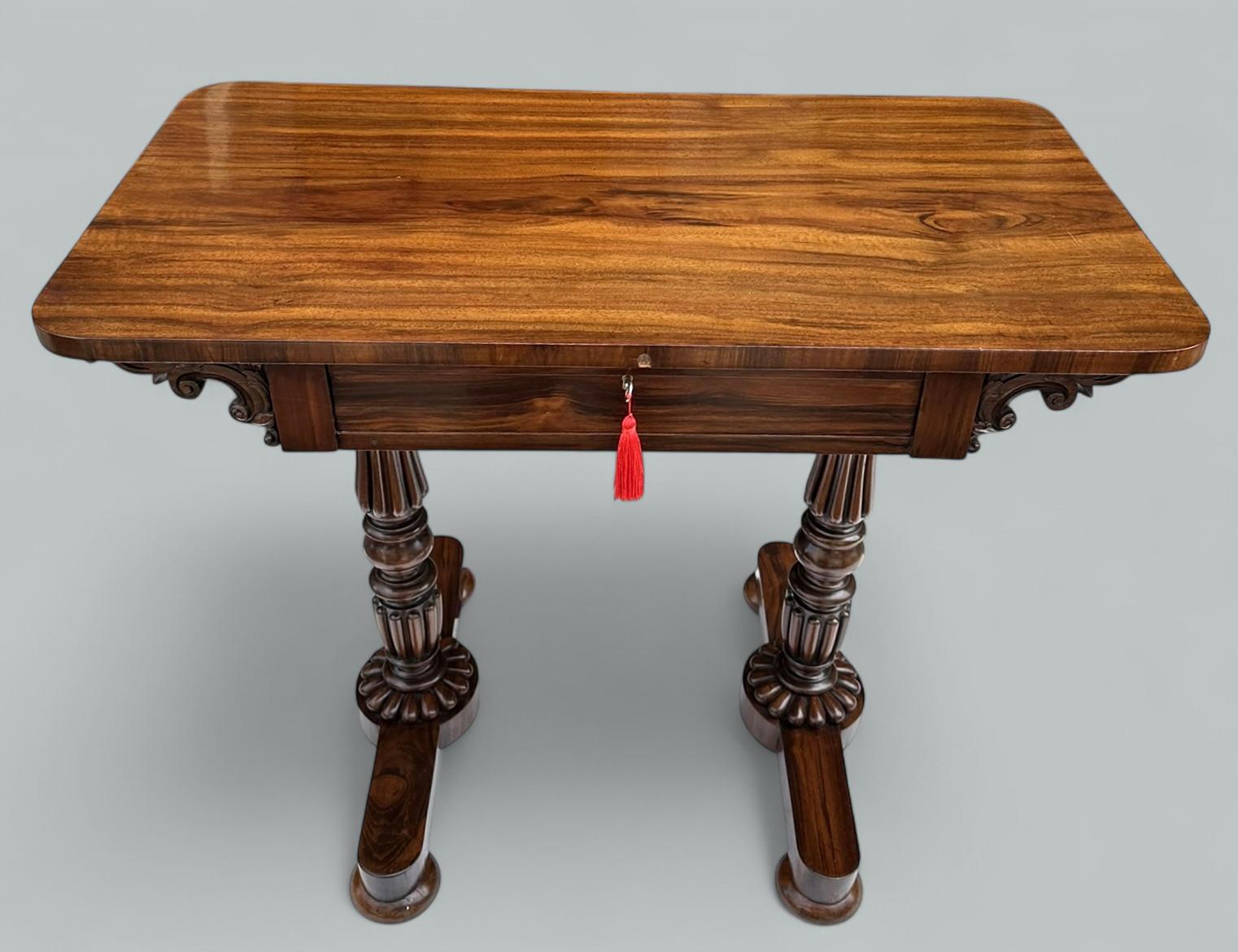 A Very Imposing example of an English well figured Rosewood Regency Period rectangular Lady’s single drawer Desk or occasional side table of compact proportions, in the manner of renowned Cabinet Makers Gillows of Lancaster and London. Circa