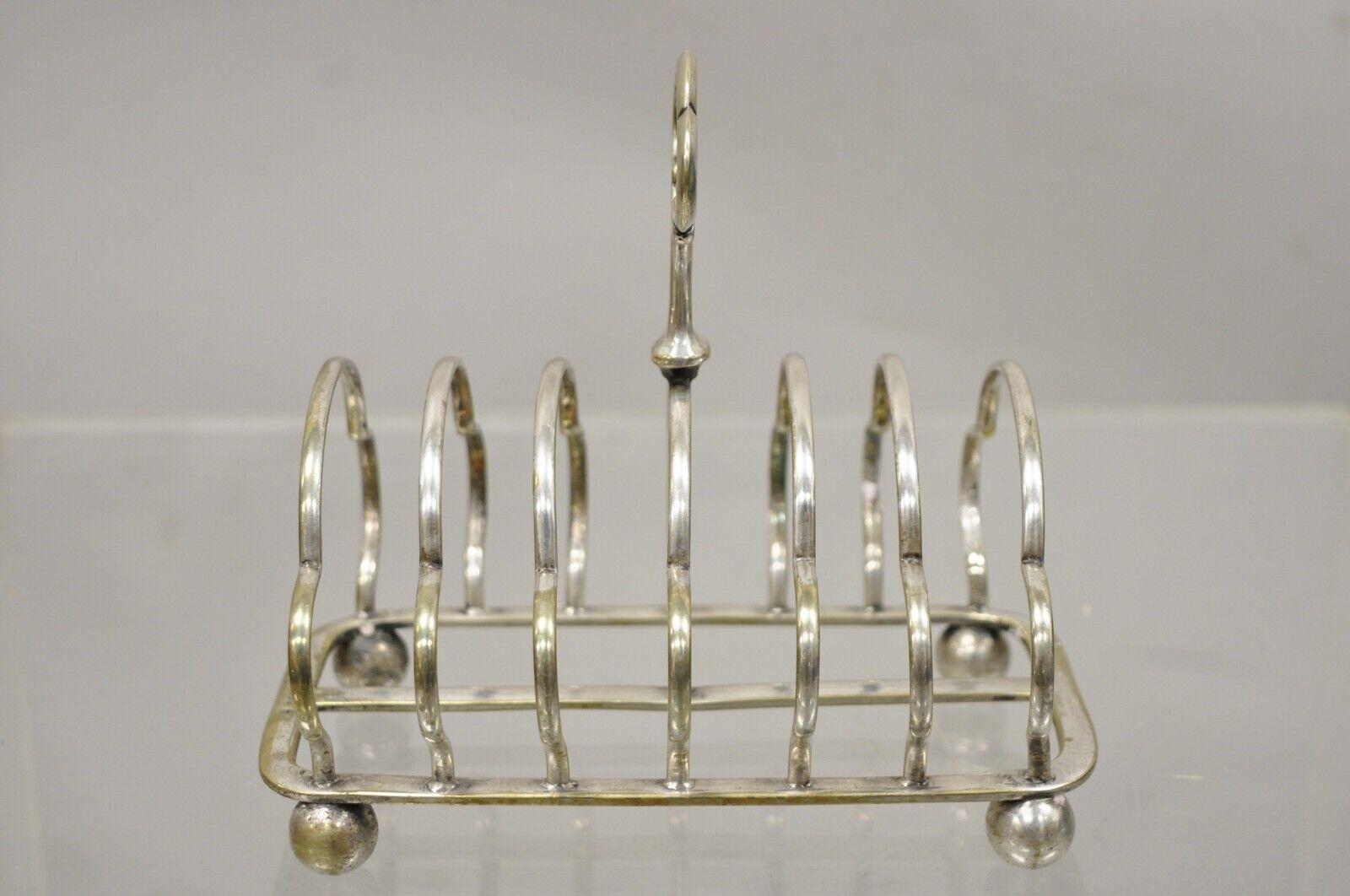 Antique English Regency silver plated toast rack letter holder ball feet (B). Item featured is raised on ball form feet, shaped divider, 6 slots, very nice antique item, quality English craftsmanship, great for use as a letter holder. Circa Early
