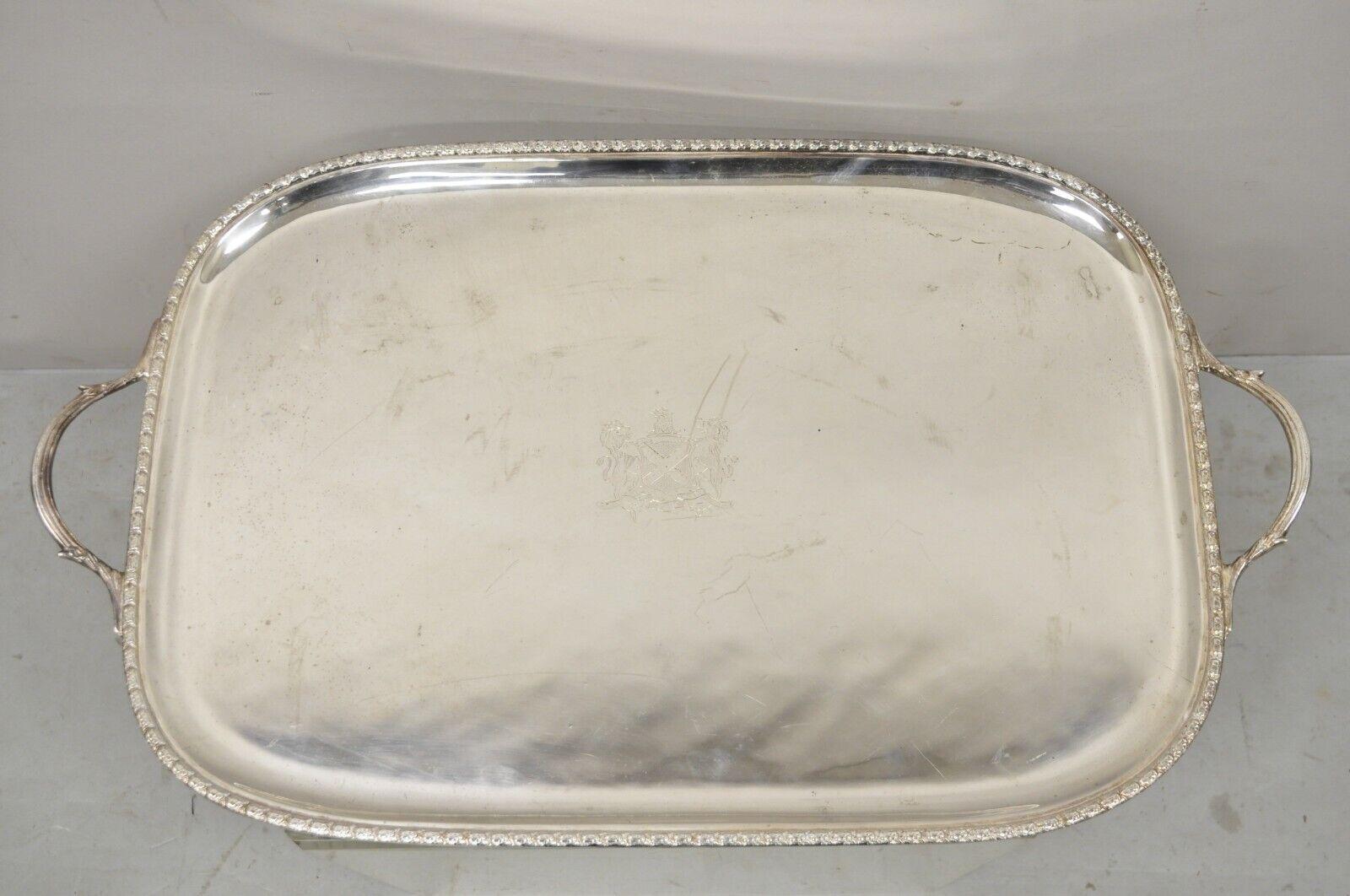 Antique English Regency silver plated twin handle tray lion and shield crest. Item features an etched lion and shield crest, twin handles, very nice antique item, quality craftsmanship, great style and form. Circa early 1900s. Measurements: 1.5