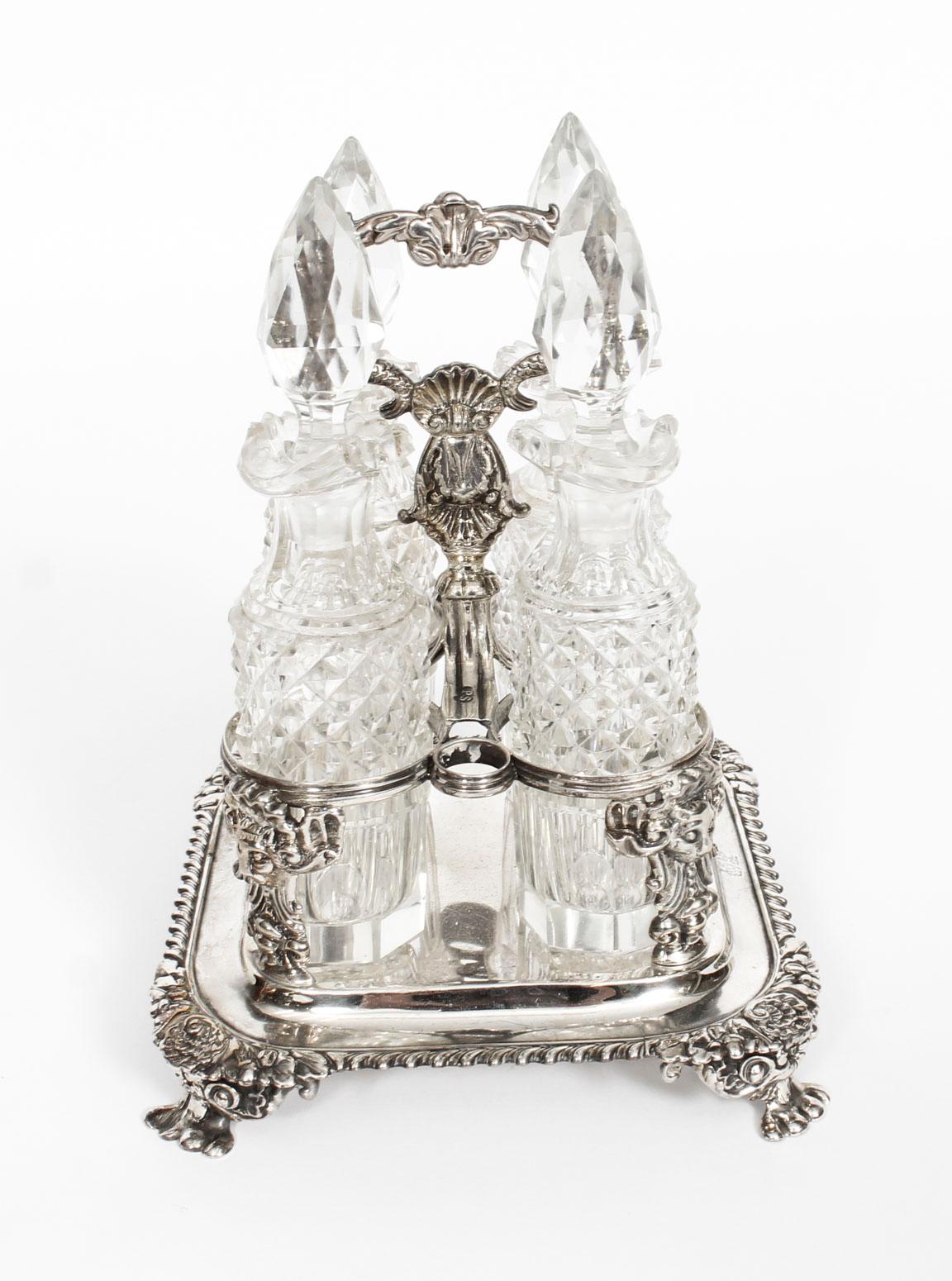 This is a fantastic antique English George III sterling silver four bottle condiment cruet with hallmarks for London 1820 and the makers mark of the renowned silversmith Paul Storr.

This rare complete set is in superb condition and features four