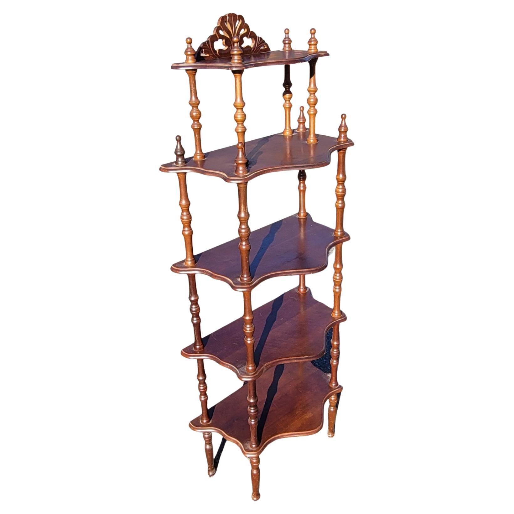 A patinated Antique English regency style mahogany narrow etagere in good condition. 
Great for displaying arts and other ornamental objects. Height is adjustable as top layer is removable.
Measures 53.50