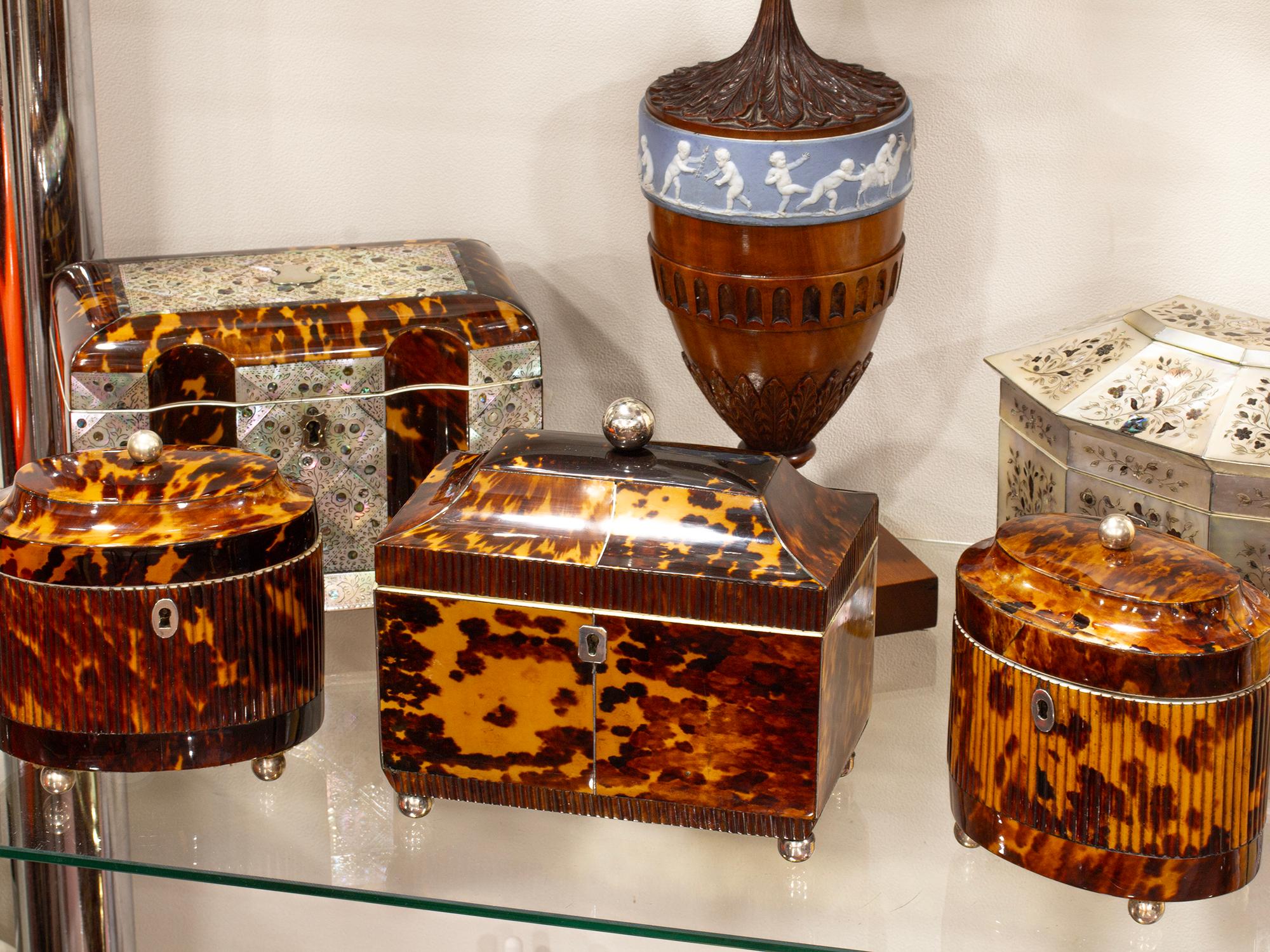 Regency Circa 1811

From our Tea Caddy collection, we are pleased to offer this Antique Regency Tortoiseshell Tea Caddy. The Tea Caddy of rectangular form with a squared body and raised cavetto lid surmounted by a silvered ball finial and stood upon