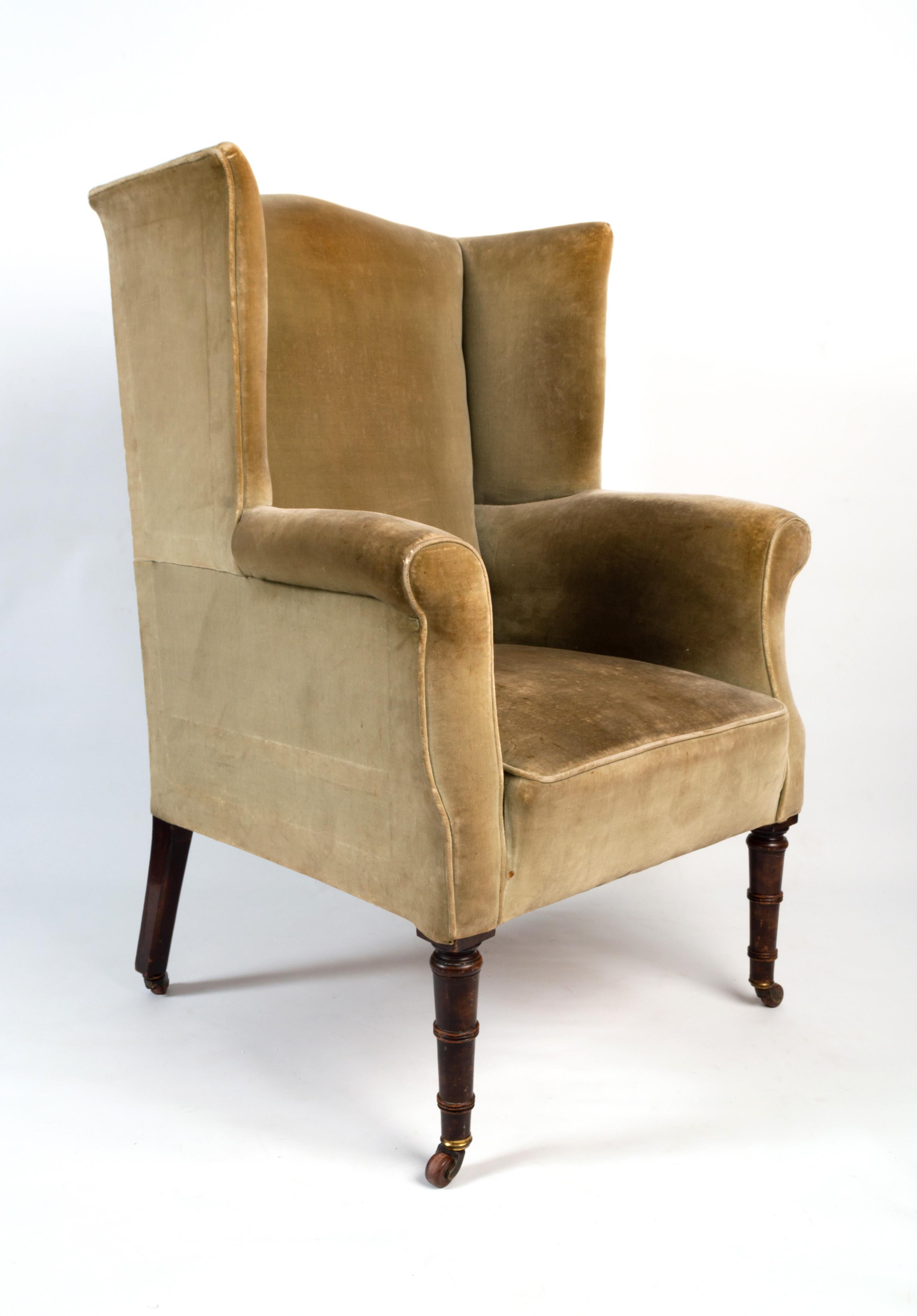 Antique English Regency Wing Armchair circa 1820
Good example in excellent condition commensurate of age. Fabric will require replacing. Standing on mahogany faux bamboo legs terminating on original brass castors.