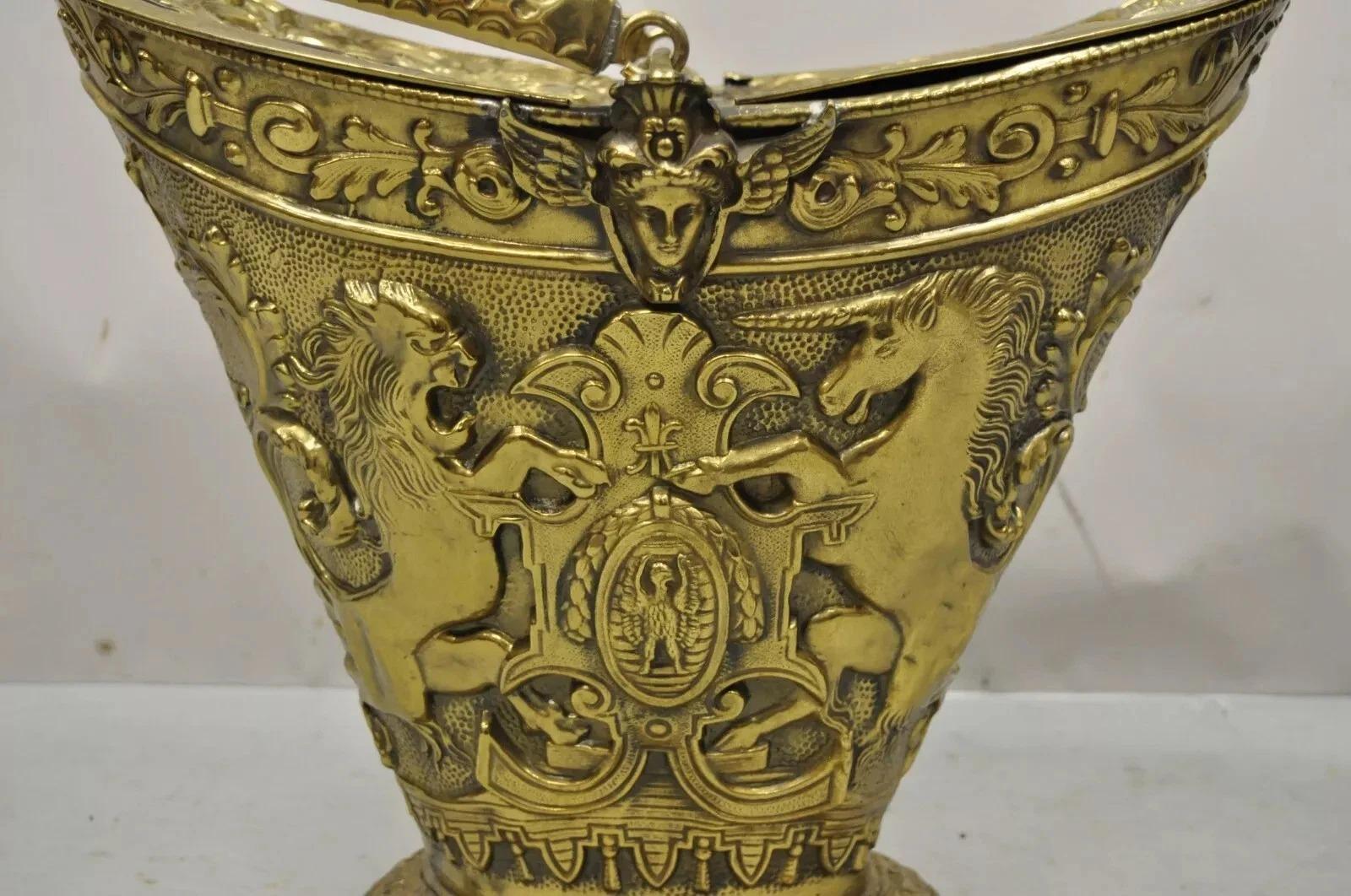 Antique English Renaissance Unicorn & Lion Brass Figural Coal Bucket Log Bin. Item features an ornate debossed brass form with lions, unicorn, shield, winged maidens, and fancy scroll work, double lift sides and handle, quality English
