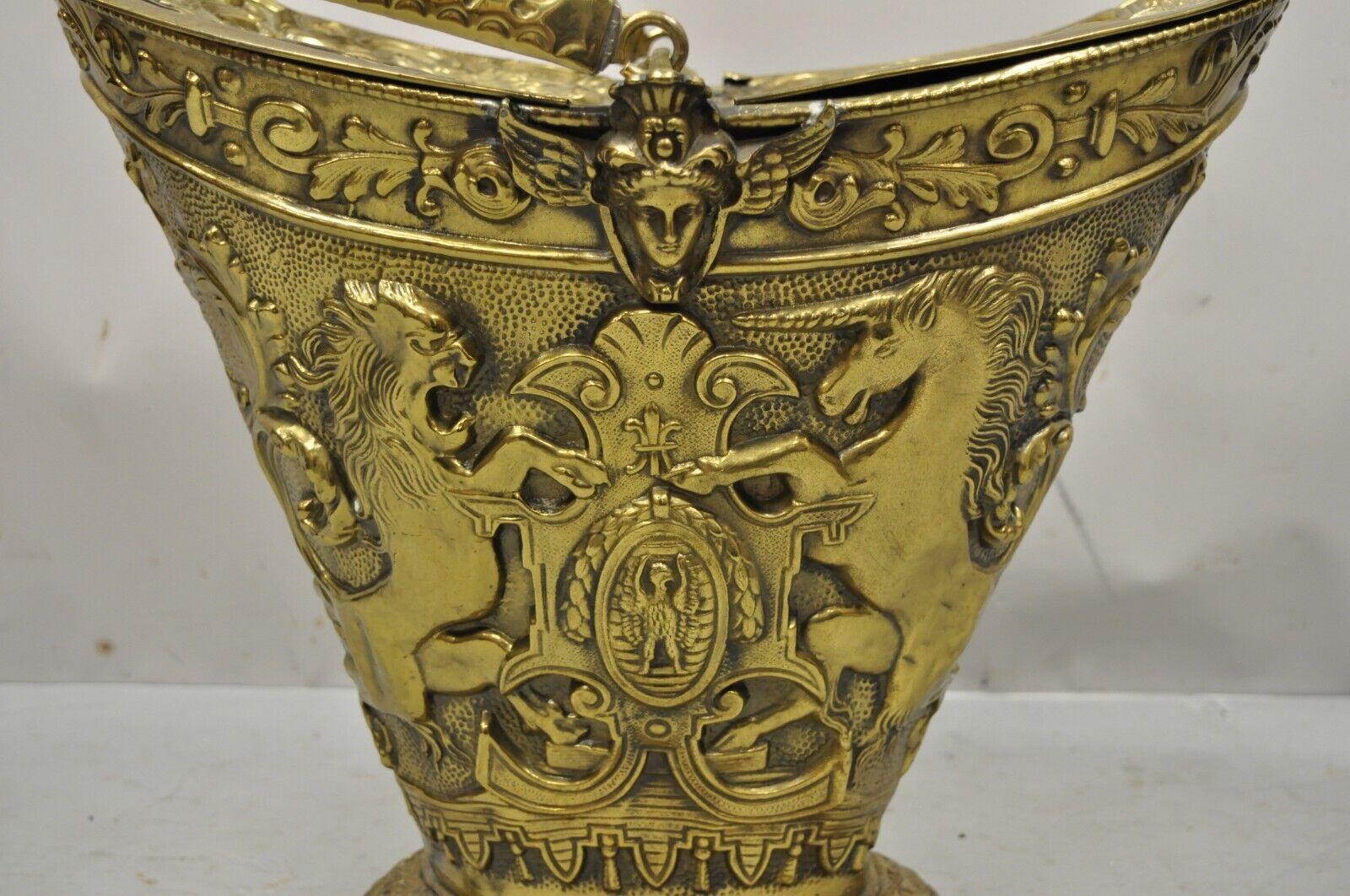 Antique English Renaissance Unicorn, lion shield figural brass coal bucket bin. Item features ornate debossed brass form with lions, unicorn, shield, winged maidens, and fancy scroll work, double lift sides and handle, quality English craftsmanship,