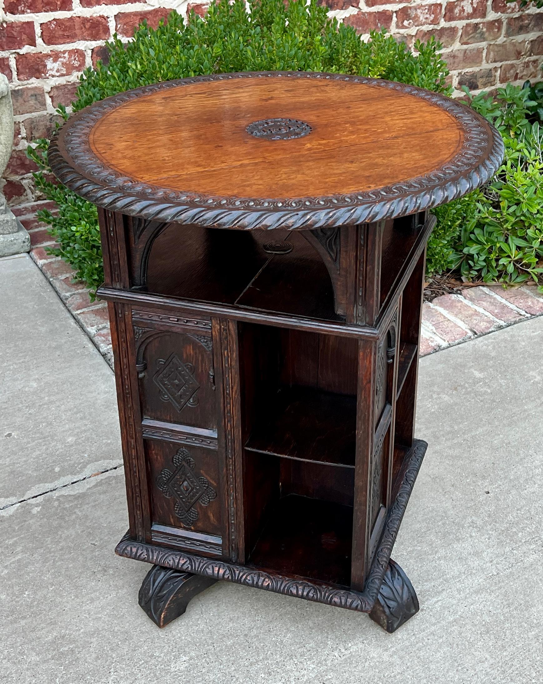BEAUTIFUL and UNIQUE Antique English Oak Revolving Bookcase or Display Cabinet with Round Table Top~~c. 1890s

PERFECT for displaying your favorite antique books or collectibles~~round top surface above shelves is flat for additional display or use