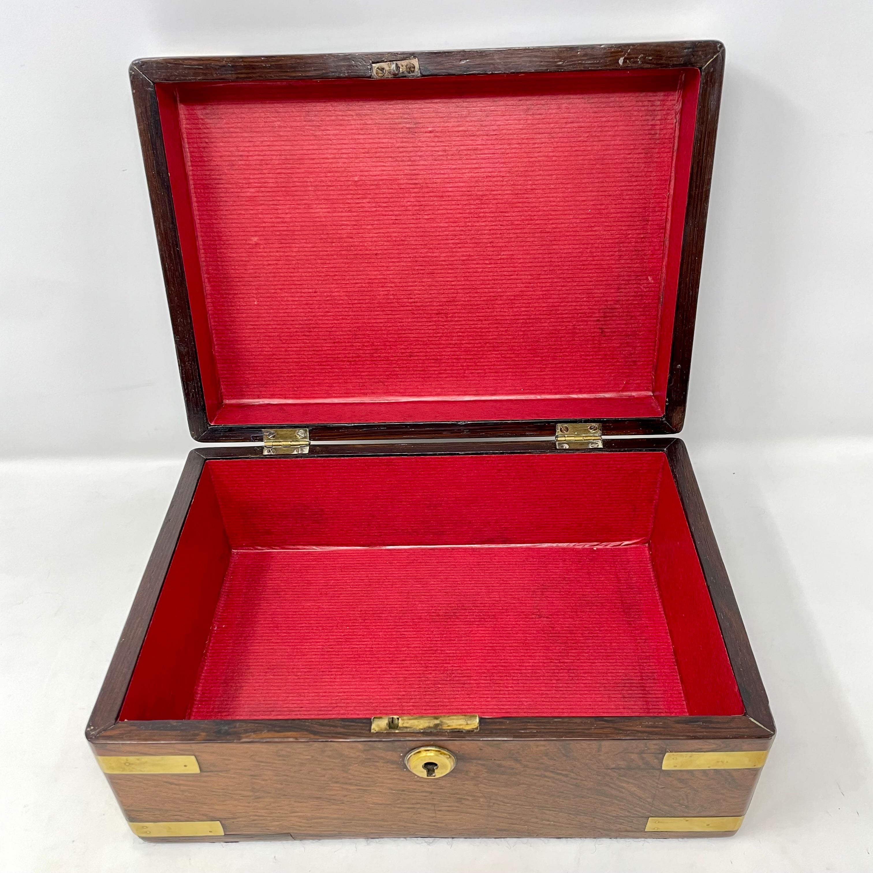 Antique English rosewood box with brass mounts, circa 1860-1870.