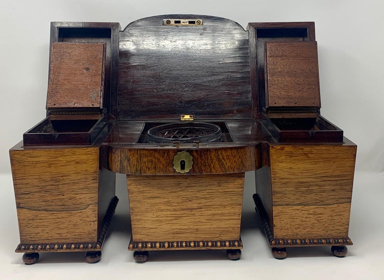 This lovely rosewood tea caddy dates to the William IV period and is very unique in its detail and shape. The caddy still has part of its original lining.