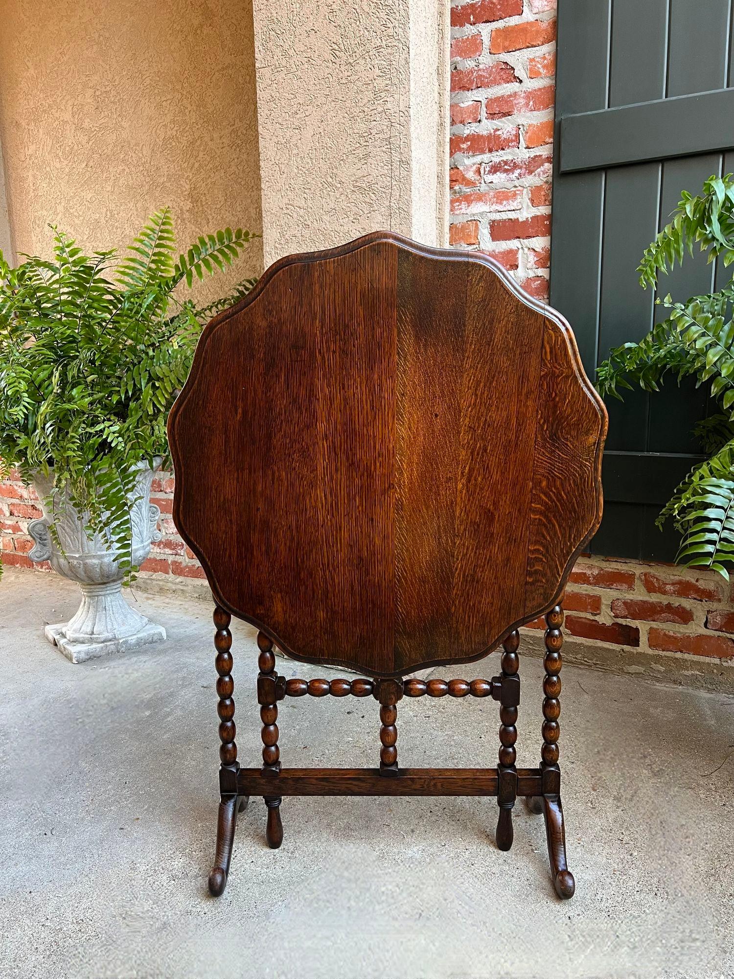 Antique English Round Table Tilt Flip Top Gateleg Folding Side Carved Oak c1900.

Direct from England, this gorgeous antique flip or tilt top table is a classic British beauty and probably one of the most sought-after tables today.
All the elements