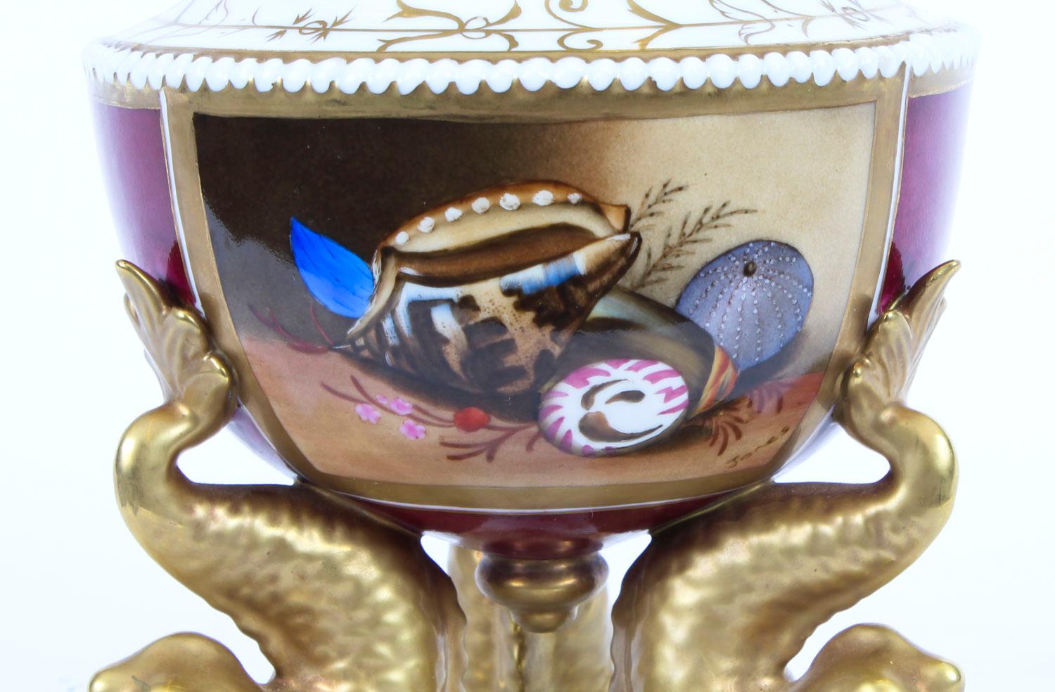 This is a beautiful English Samson 'Derby' pot pourri vase and cover date stamped 1863-1866.

The dish is of classical form and features a superbly hand painted panel of seashells, signed Jones, with gilded high lights on a burgundy ground.

It