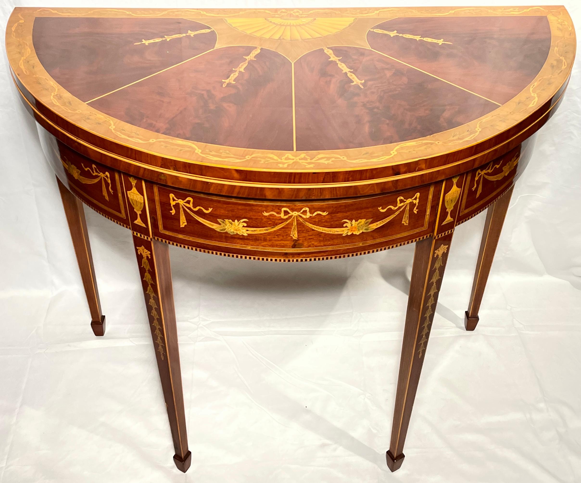 Antique English satinwood inlaid mahogany demi-Lune table, Circa 1890's.
Measurements: 
31 inches high 
36 inches wide
36 inches deep (open)
17.75 inches deep (closed). 

