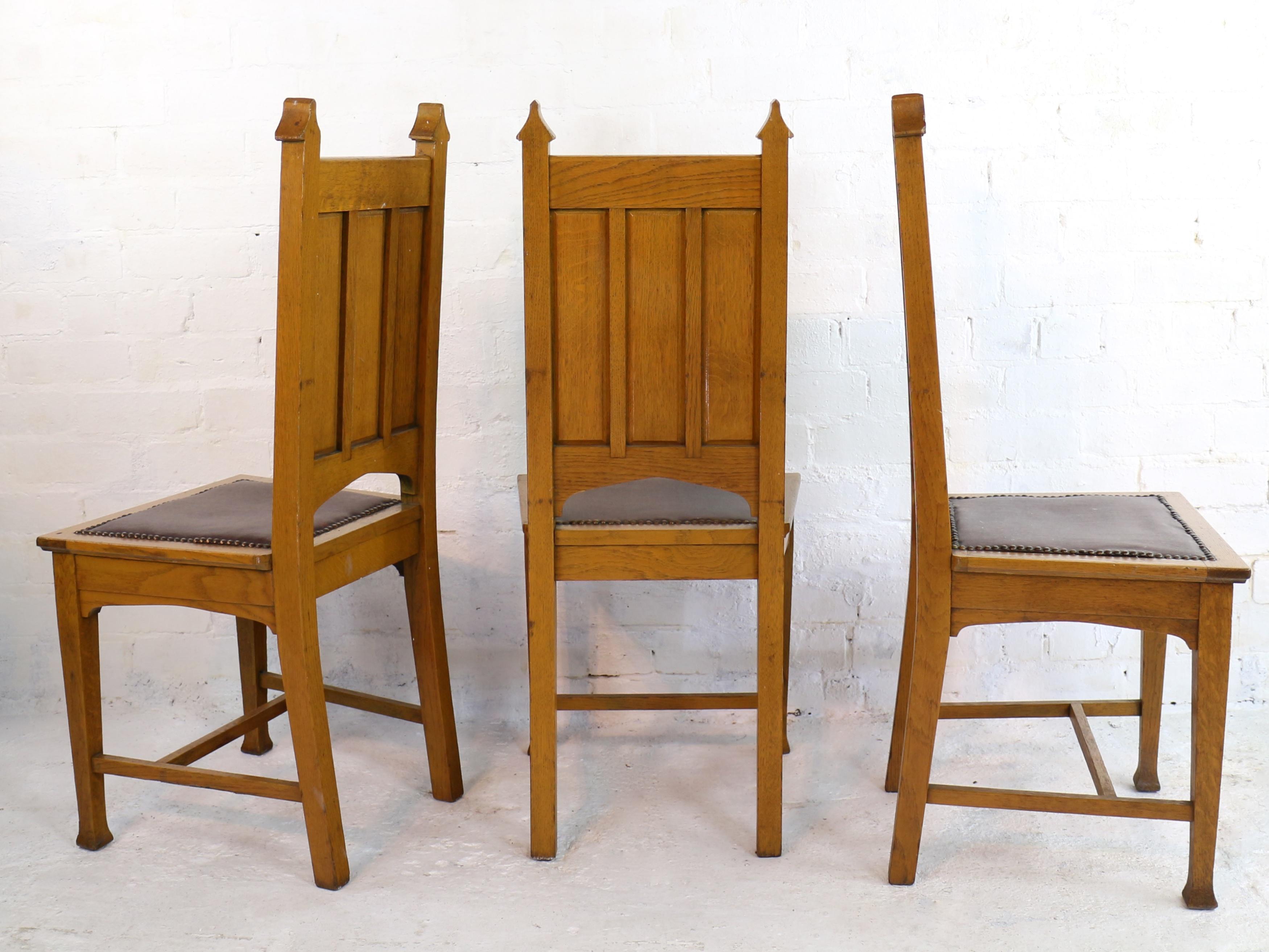 Antique English Set of 12 Gothic Revival Arts & Crafts Oak Dining Chairs In Fair Condition In Glasgow, GB