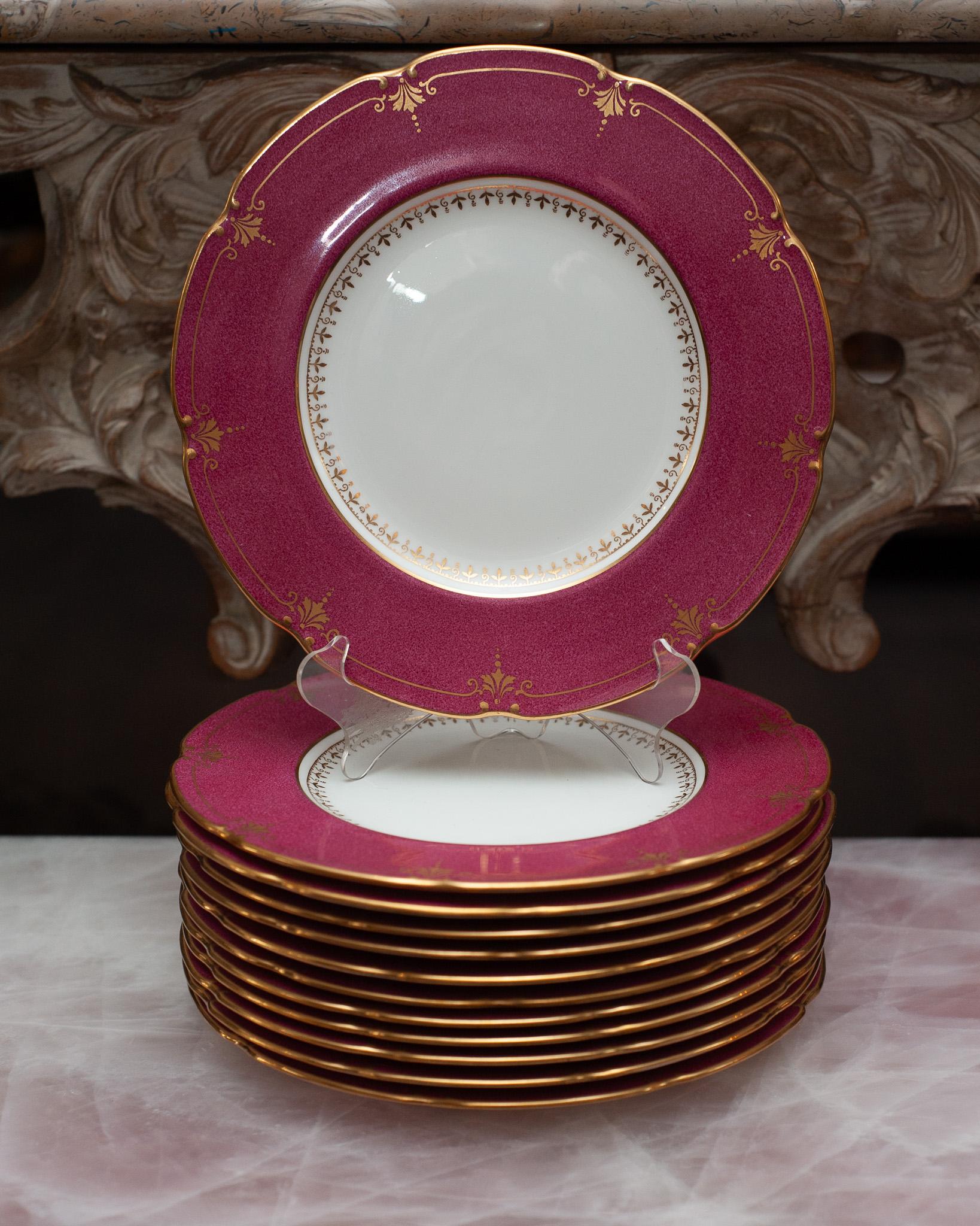 A set of 12 antique English Wedgwood cranberry side plates, made for Bailey, Banks & Biddle Co, Philadelphia, circa early 19th century. Ornate and delicately gilt, the cranberry colour is sure to delight and uplift any tablescape. 