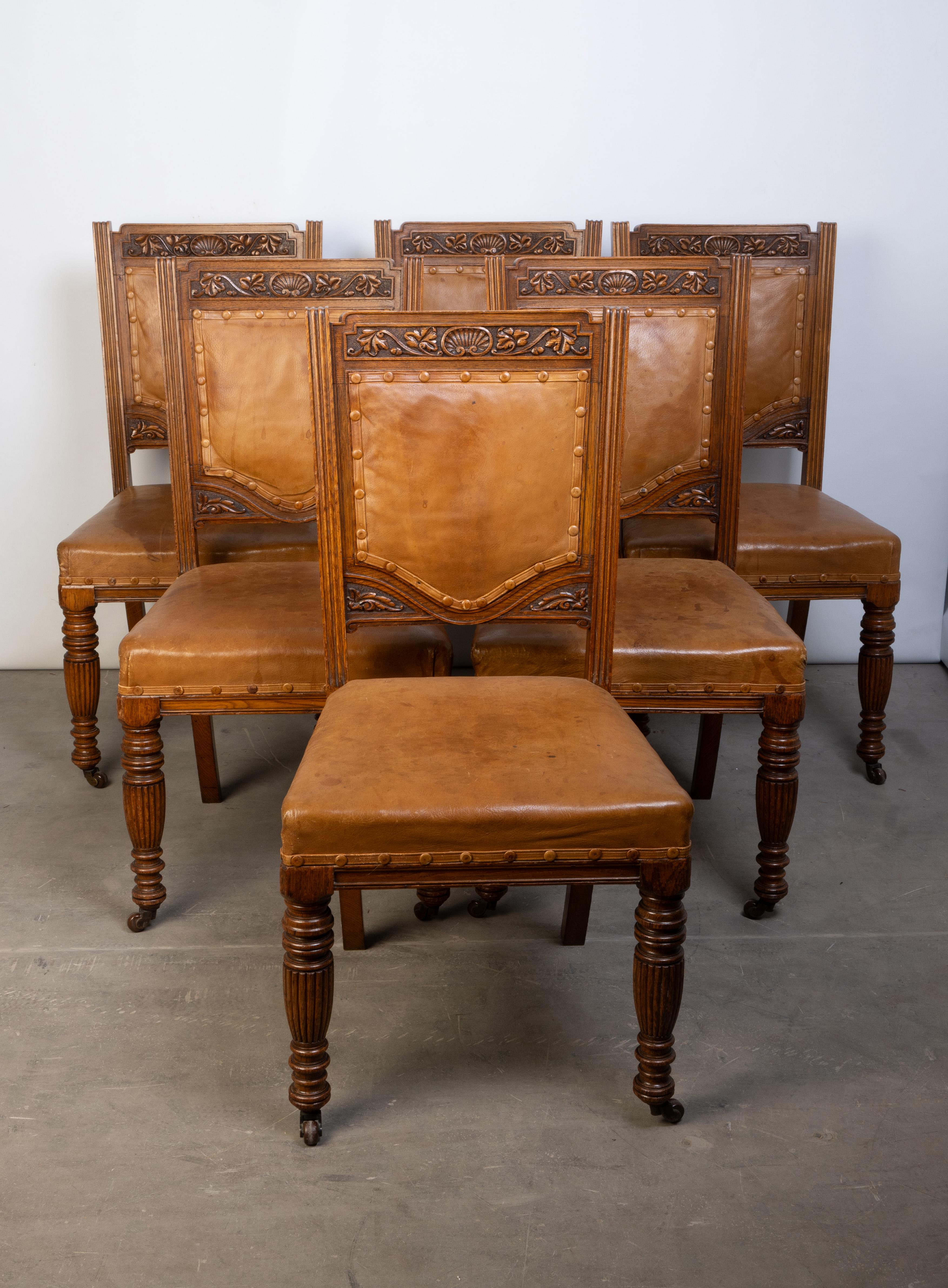 Antique English Set Of Six Elizabethan Revival Dining Chairs 
By Robson & Sons, Newcastle. High quality cabinet makers of the 19th Century.

In the Elizabethan revival manner, the padded backs with foliate carved surrounds, above over stuffed seats