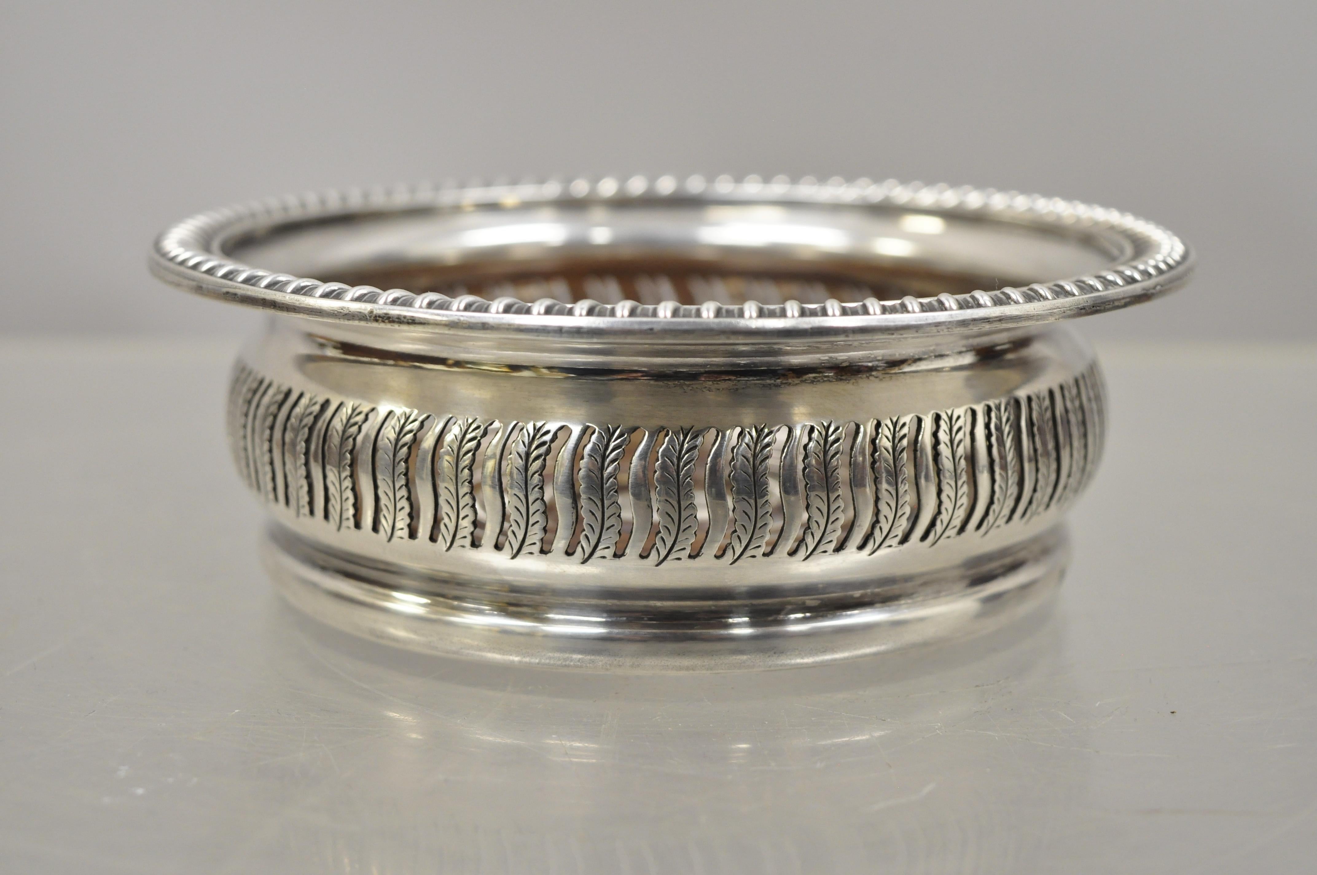 Antique English Sheffield Georgian Regency silver plate and mahogany wine coaster. Item features pierce decorated sides, mahogany interior, marked 