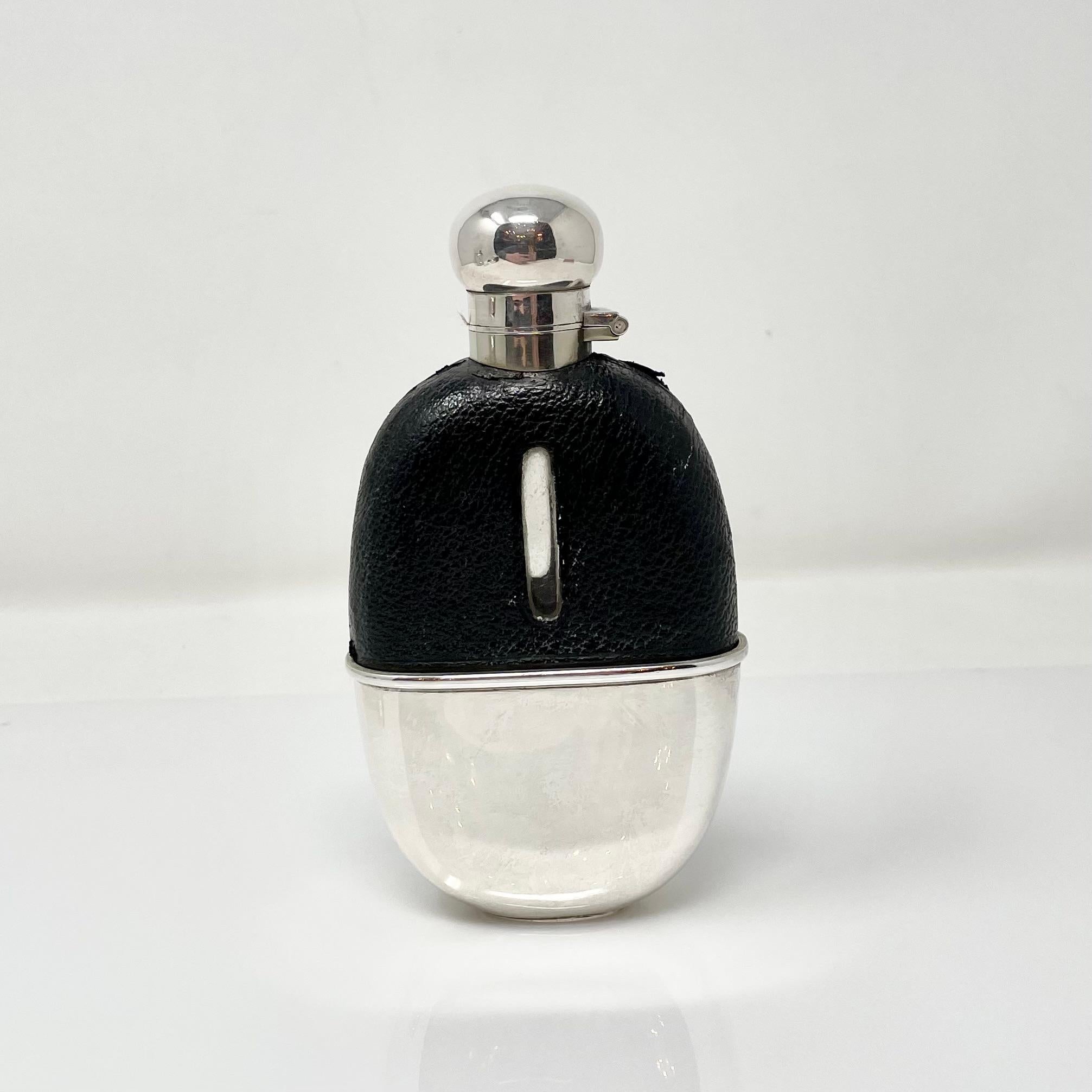 Antique English Sheffield glass and silver-plated hip flask mounted with leather and removeable cup, circa 1880.