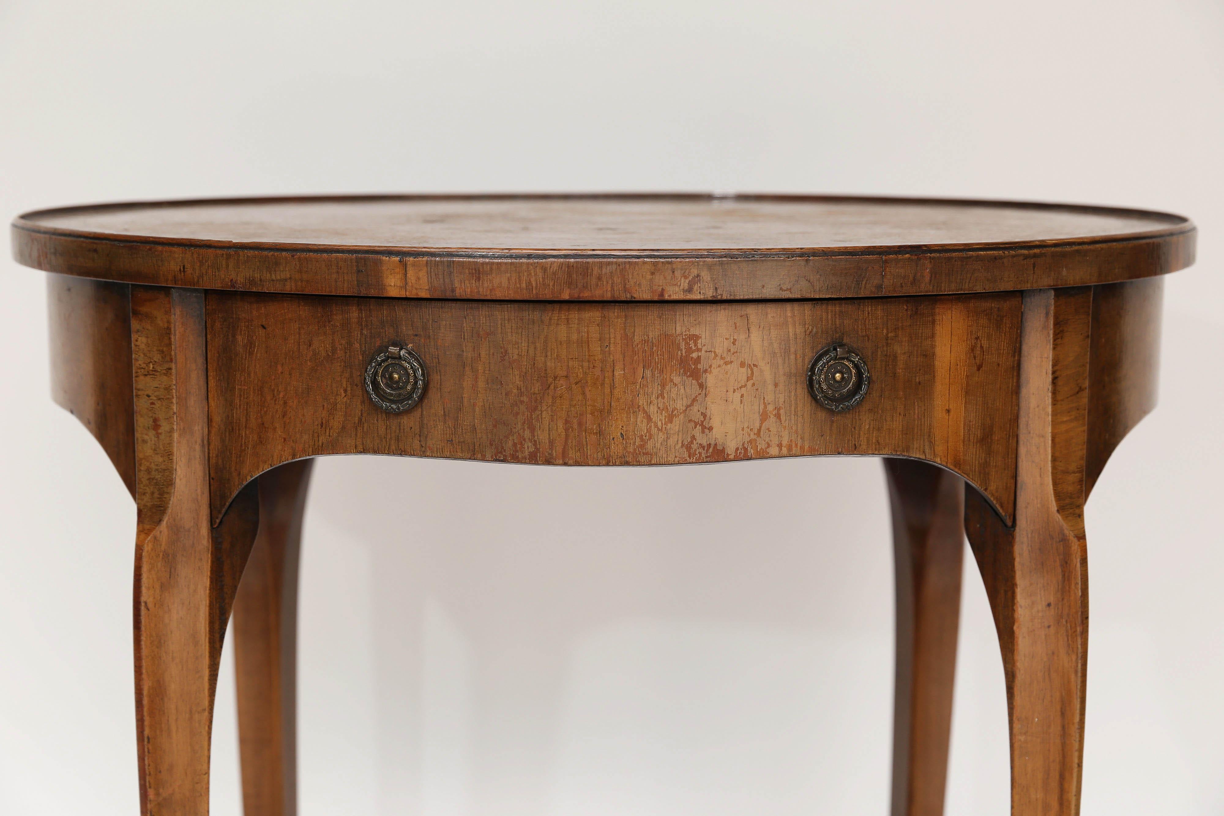 Found in England, this side table is sure to delight. Featuring one drawer, a lower shelf and beautiful classic lines, this table could be used as a side table, tea table, end table or drinks table.