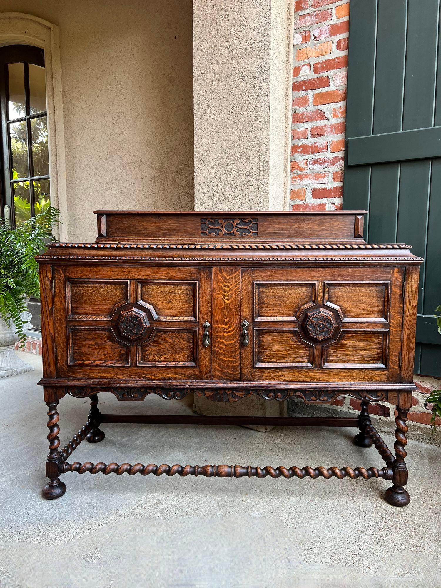 Antique English Sideboard Server Buffet BARLEY TWIST Carved Tiger Oak Jacobean.

Direct from England, a gorgeous antique English sideboard with classic British style and design, certain to enhance any décor!
Beautiful English tiger oak grain