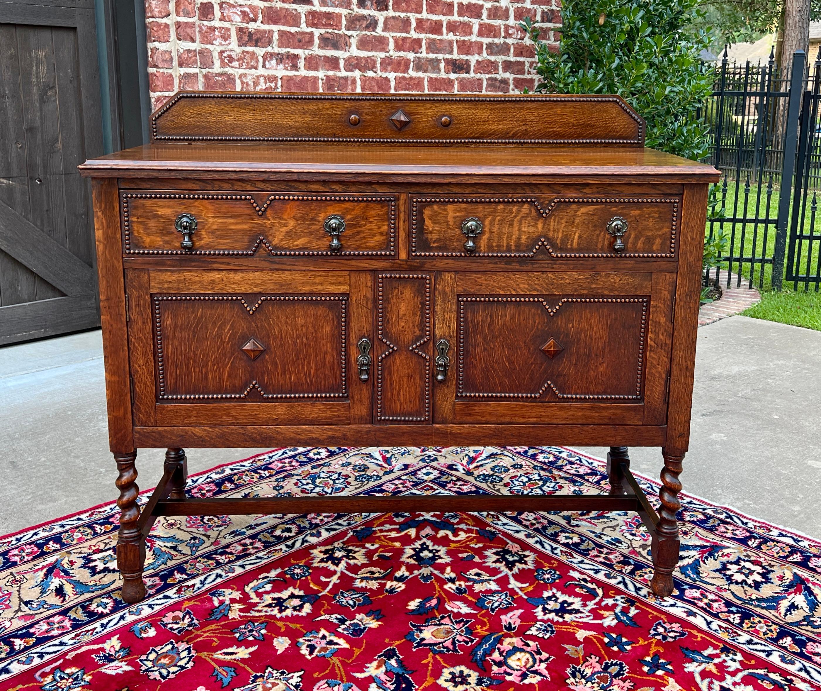     CHARMING Antique English Honey Oak Jacobean Sideboard, Cabinet, Server or Buffet c.1930s.

    Exquisite barley twist legs with beaded trim featuring two (2) drawers and two(2) doors with pegged backsplash

    41