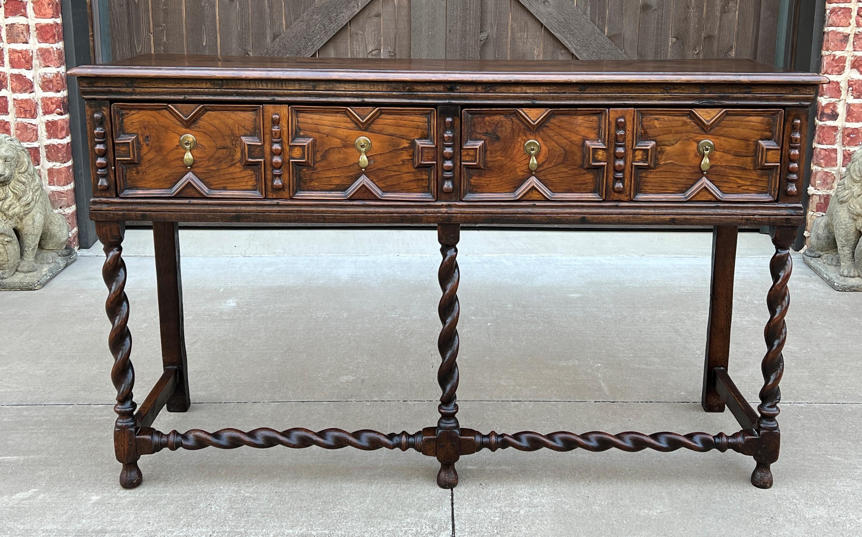 Gorgeous antique English oak Jacobean barley twist server, sideboard, sofa table, console, or buffet with two center drawers~~c. 1890s


Full of character and classic~~English Jacobean style sideboard or sofa table with barley twist legs~~display