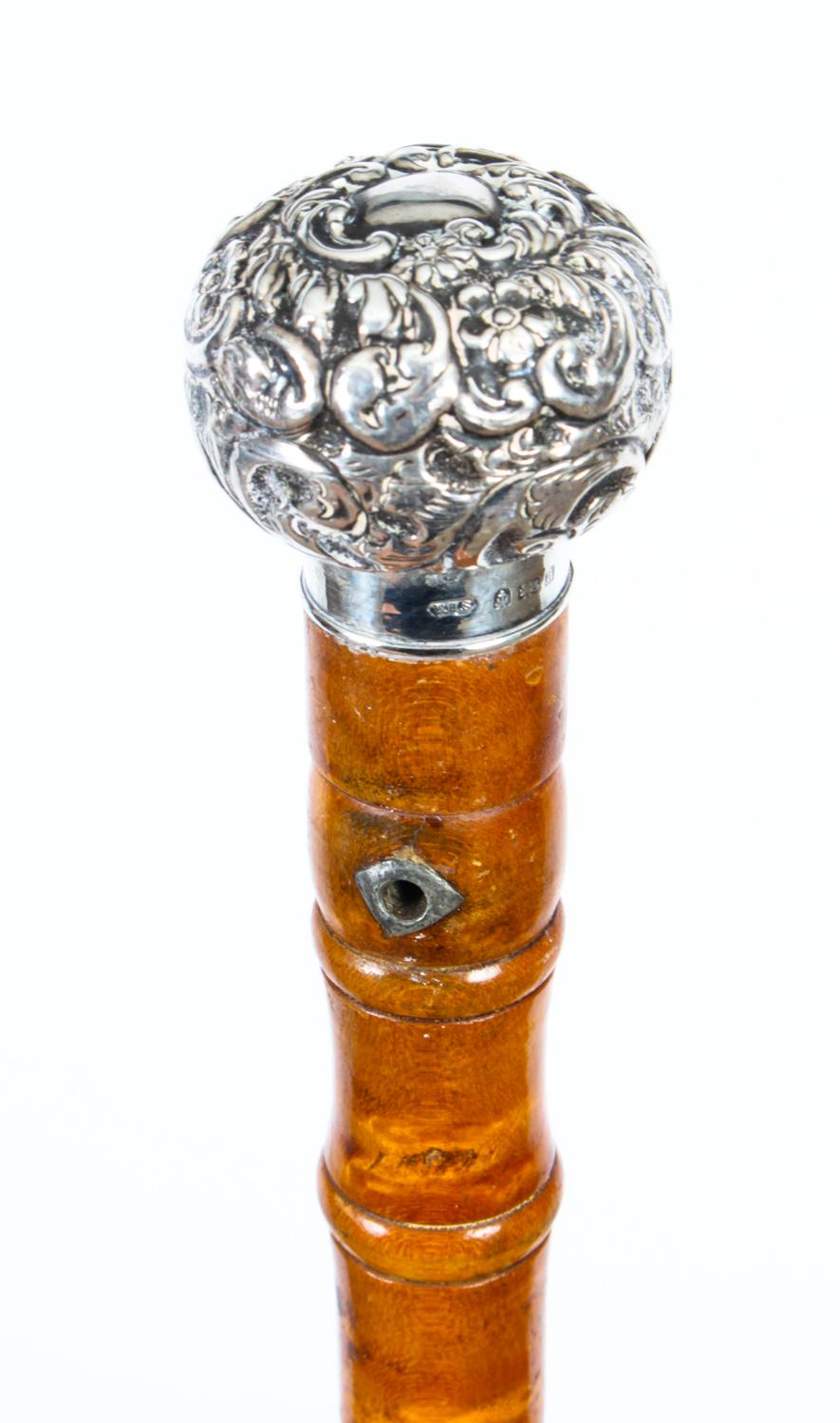 This is a beautiful antique English gentleman's birds eye maple and sterling silver pommel walking stick bearing hallmarks for Birmingham dated 1903.
 
The striking stick features an ornate silver pommel embossed with scrolling foliage on a gentle