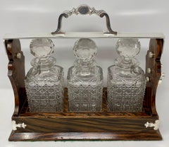 Antique English Silver Mounted Black Walnut 3 Bottle Tantalus, Circa 1880.