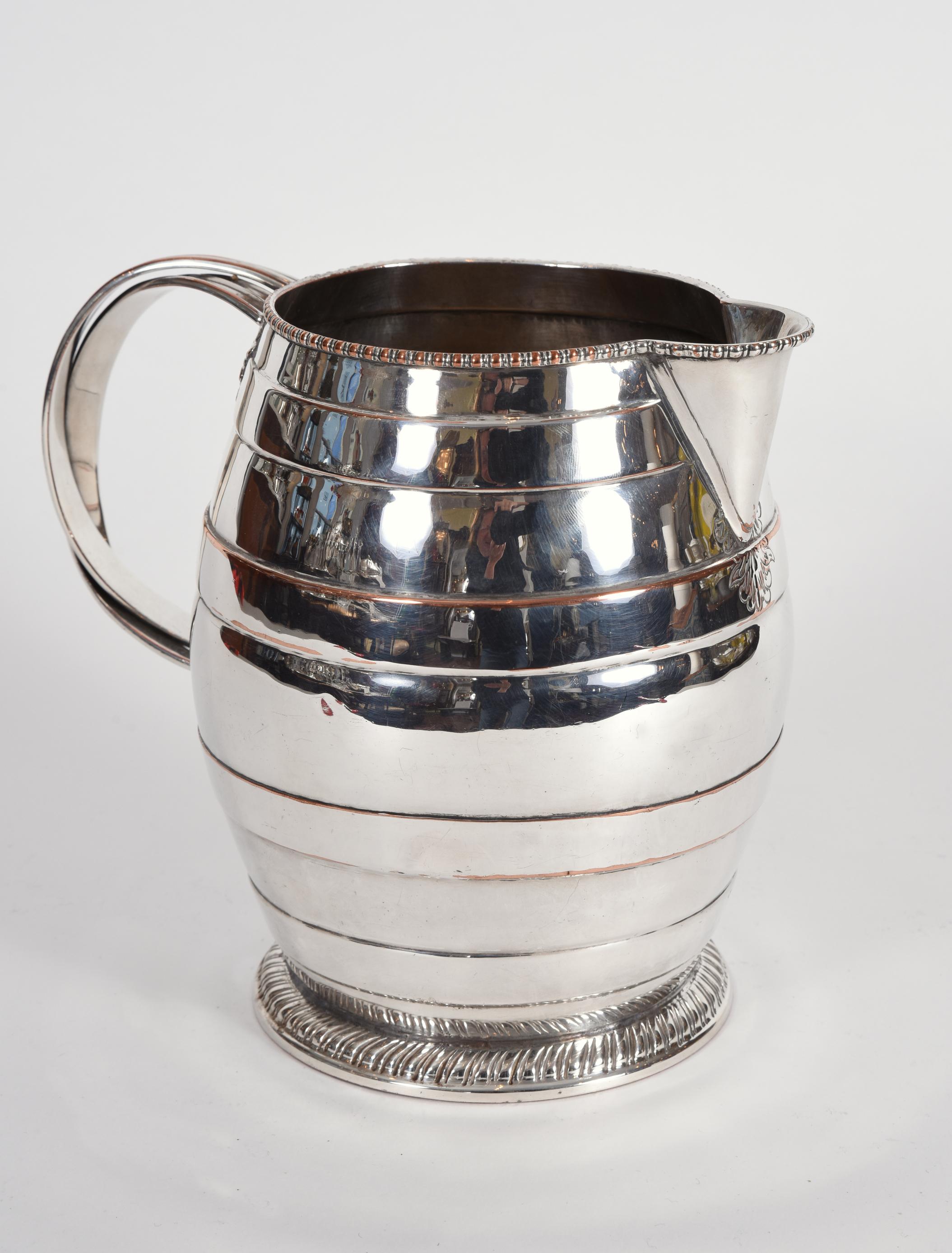 silver on copper water pitcher