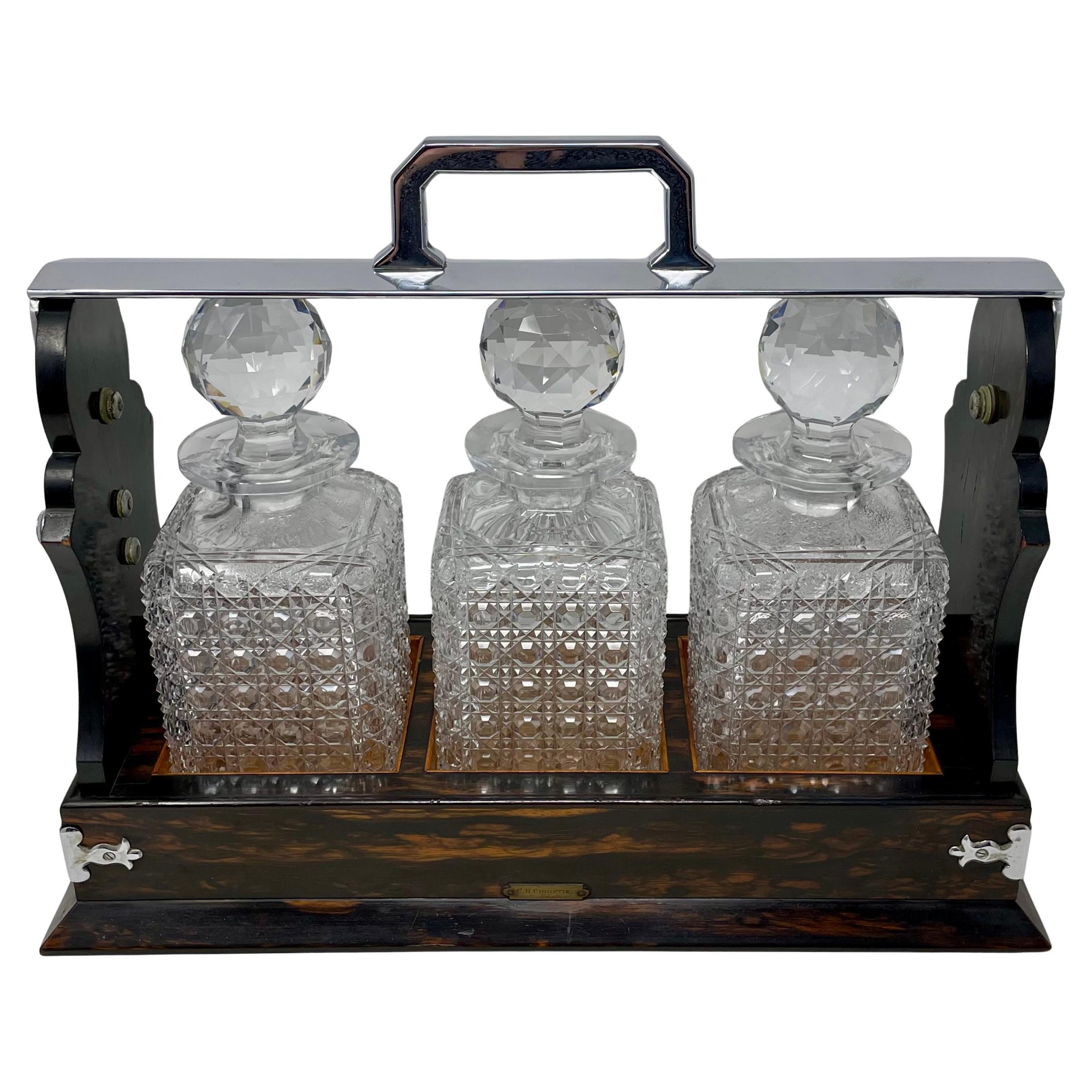 Antique English Silver Plate, Coromandel Wood and Cut Crystal 3 Bottle Tantalus. In Good Condition For Sale In New Orleans, LA