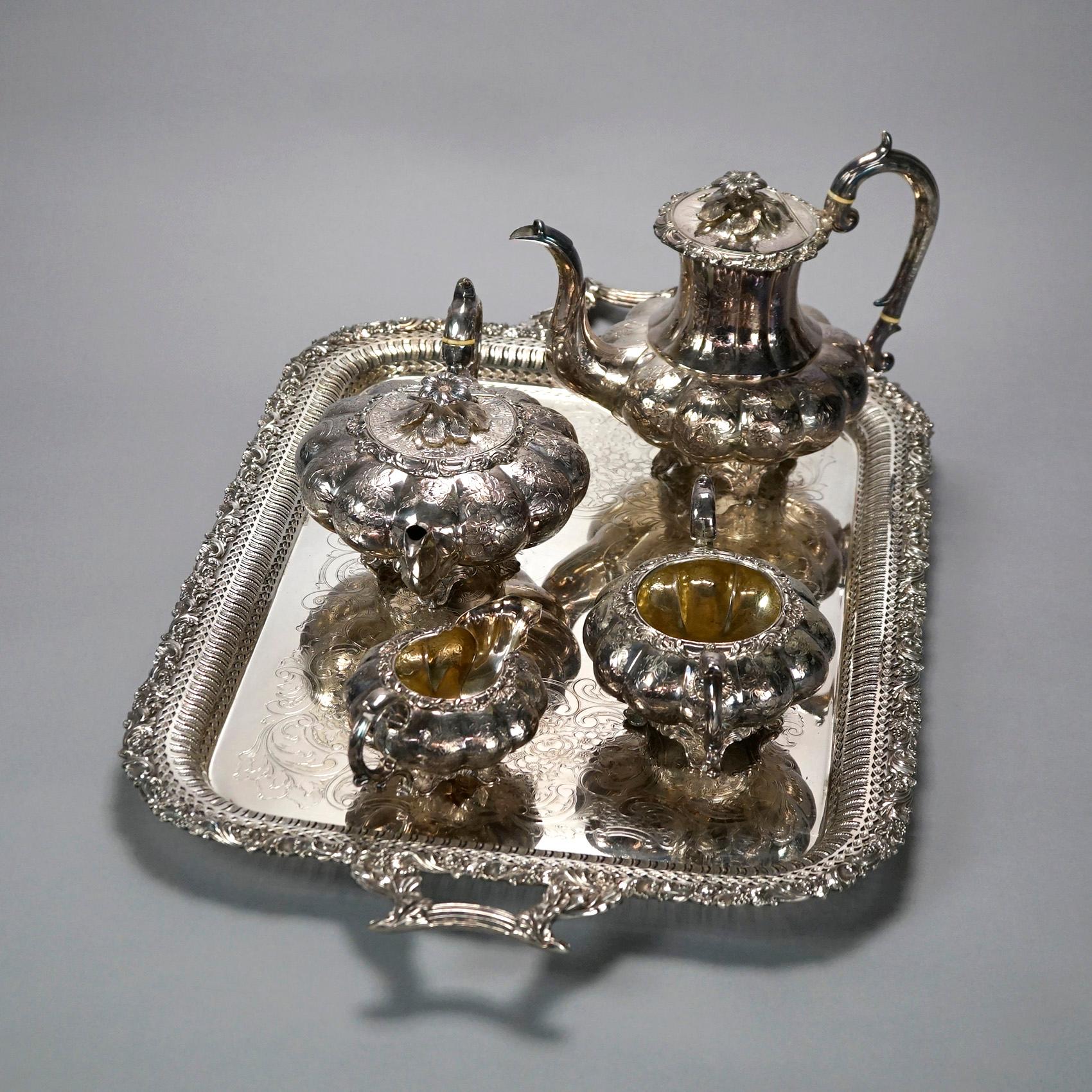 AN antique English tea set offers silver plate melon form tea pot, coffee pot, creamer, sugar and under tray, floral engraved decoration throughout, 19th century

Measures- 
Sugar Bowl: 4.5''H x 8.75''W x 5.5''D
Hot Water Pot: 6''H x 12.25''W x
