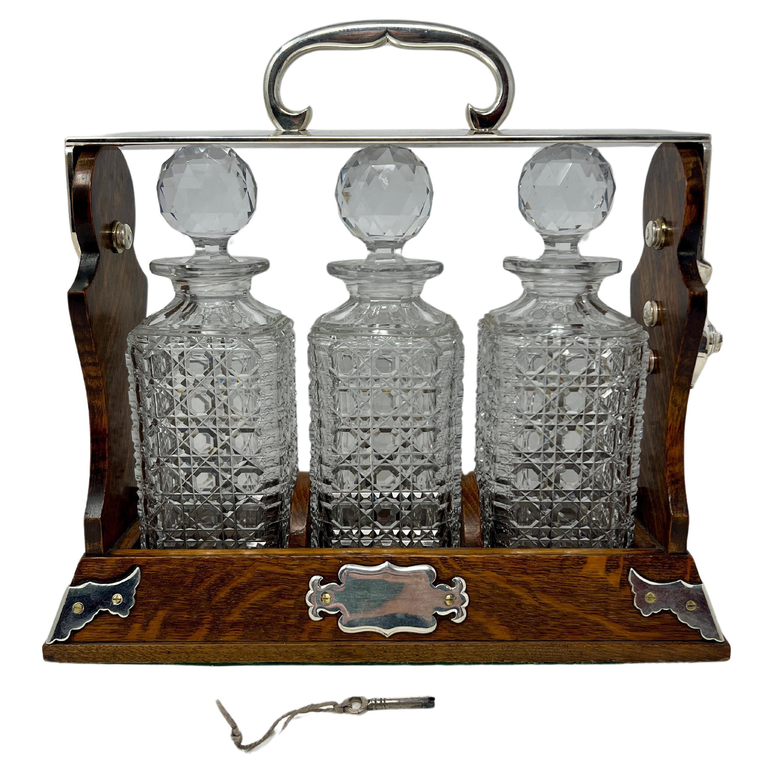 Antique English Silver-Plate & Golden Oak Three Bottle Tantalus, Circa 1880.