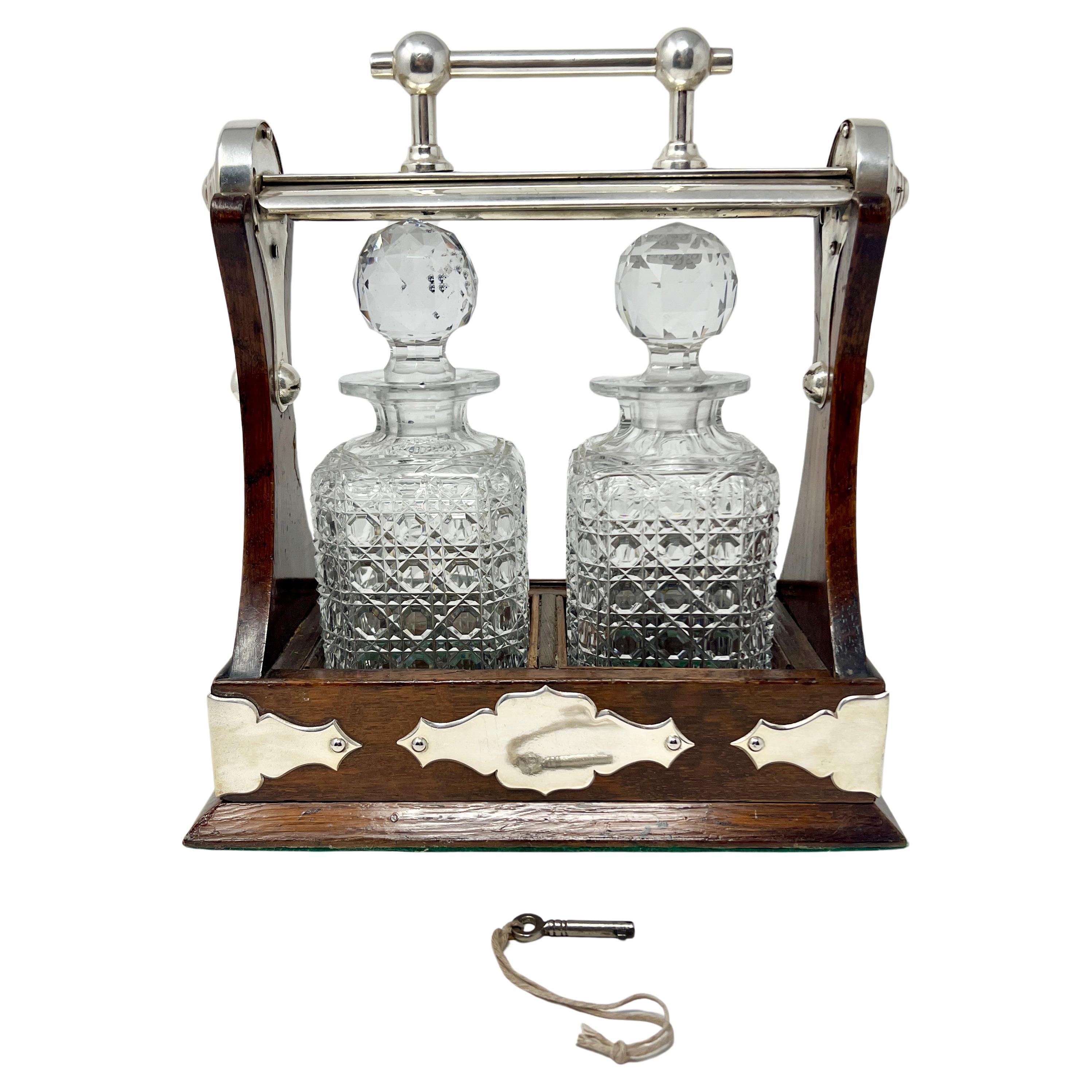 Antique English Silver Plate Mounted Oak & Crystal 2 Bottle Tantalus, Circa 1880 For Sale