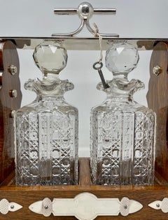 Antique English Silver Plate, Oak and Cut Crystal 2 Bottle Tantalus, Circa 1890.