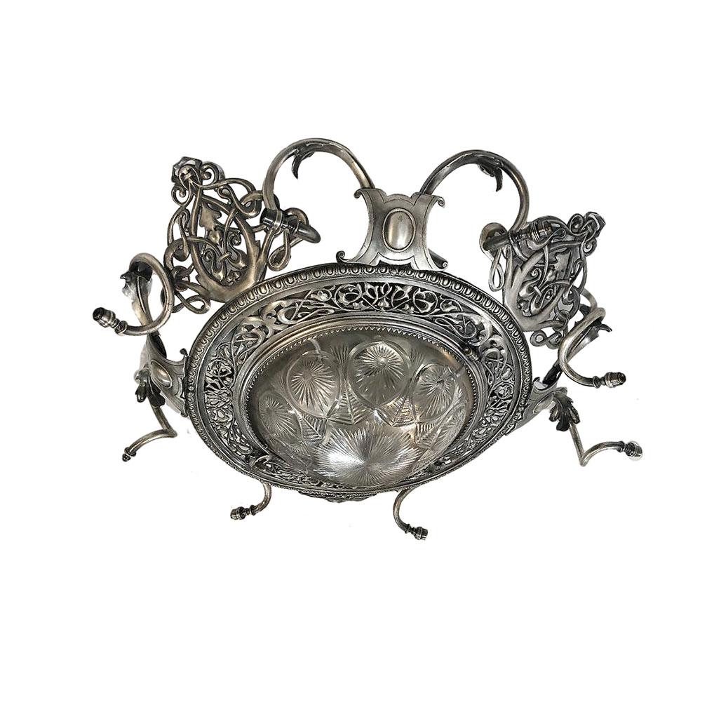 An English circa 1900 silver plated light fixture with crystal inset on the bottom and interior lights.

Measurements:
Diameter 38
