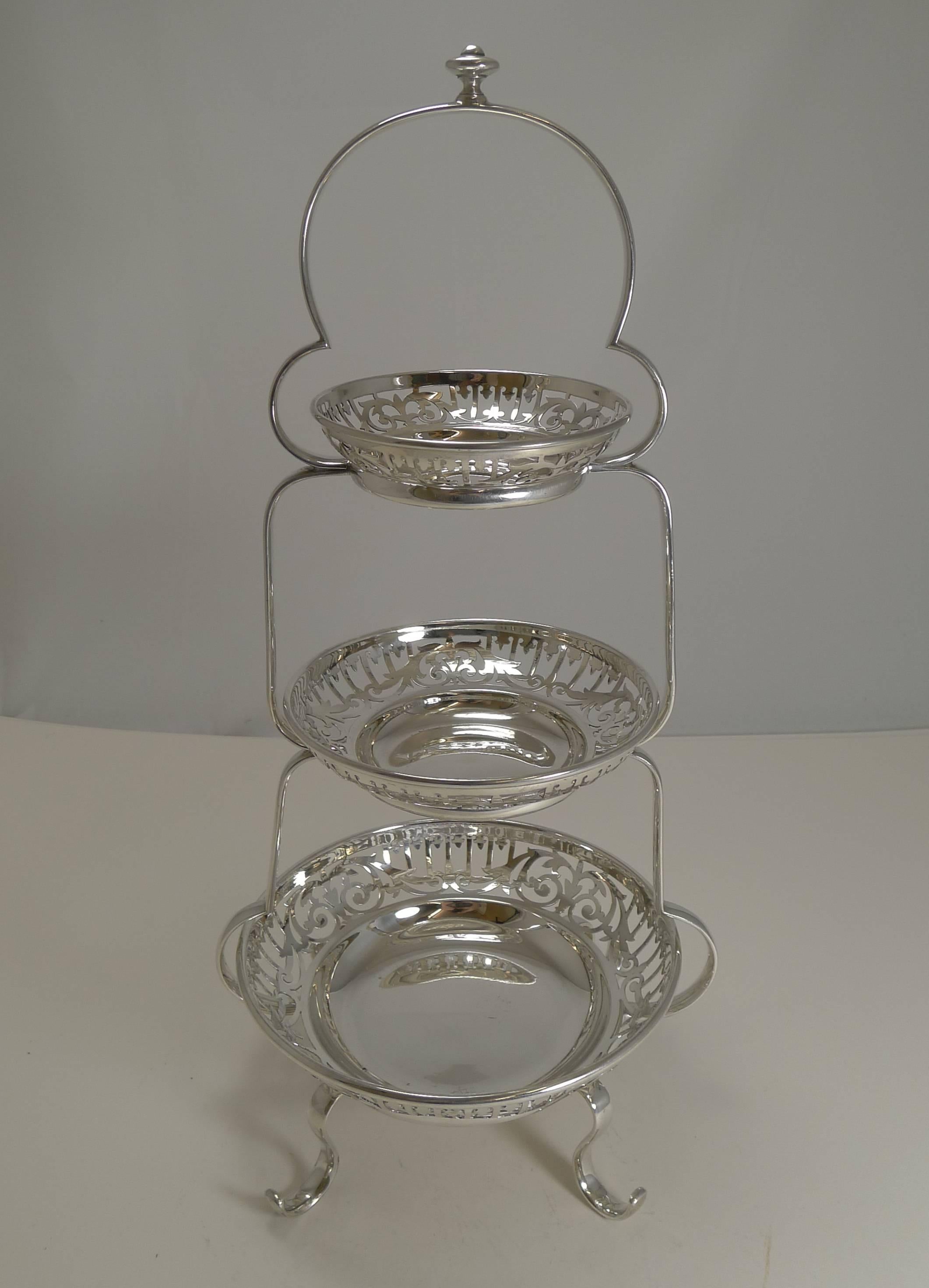 A wonderful and scarce example of an Edwardian cake stand with three graduated dishes ranging from 7 1/2