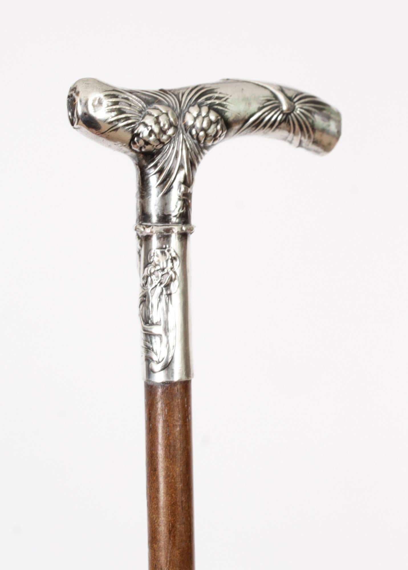 This is a beautiful antique silver plated walking stick, circa 1880 in date
 
The striking stick features an ornate silver Crutch handle featuring a profusely embossed foliage design, on a gentle tapering ebonized shaft.
 
Add an extravagant element