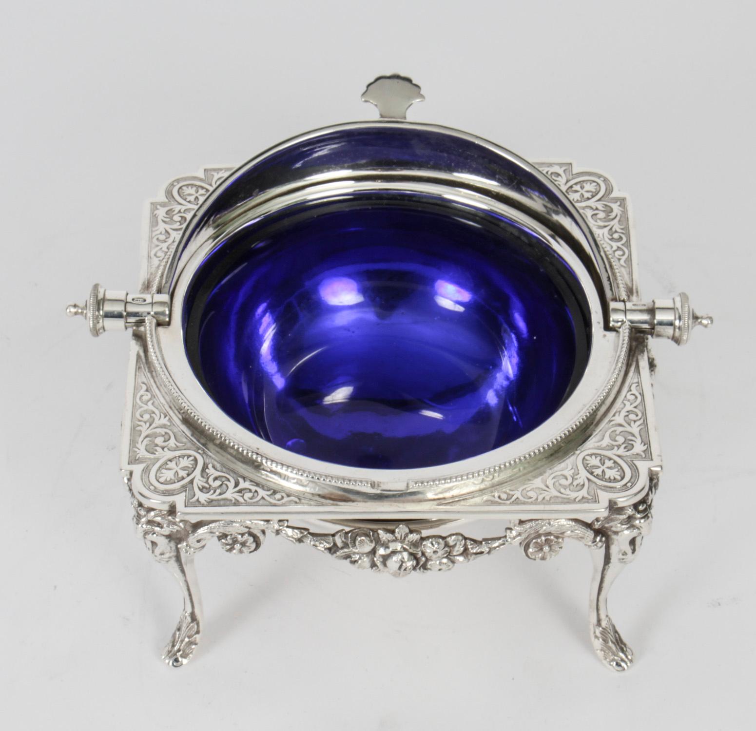 This is a gorgeous antique English Victorian silver plated roll over butter dish, also ideal for caviar, Circa 1870 in date.
 
The domed roll top features superb engraved and cast decoration the underside on a square shaped base with lion mask