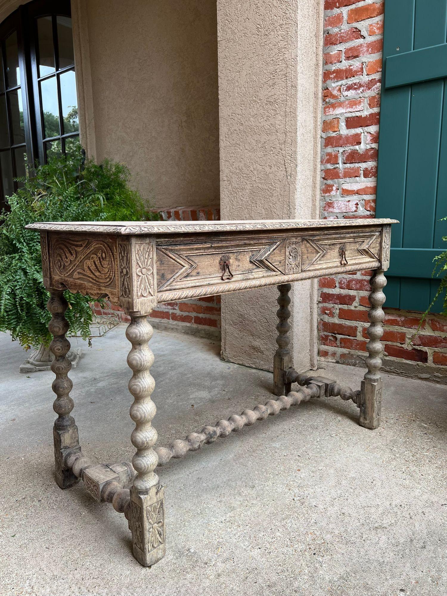 Antique English Sofa Console Table Bleached Jacobean Carved Oak Foyer Table.

Direct from Europe, a beautiful antique English sofa or foyer table, in solid oak, with a gorgeous patina--recently bleached for today’s home!
Old World character and