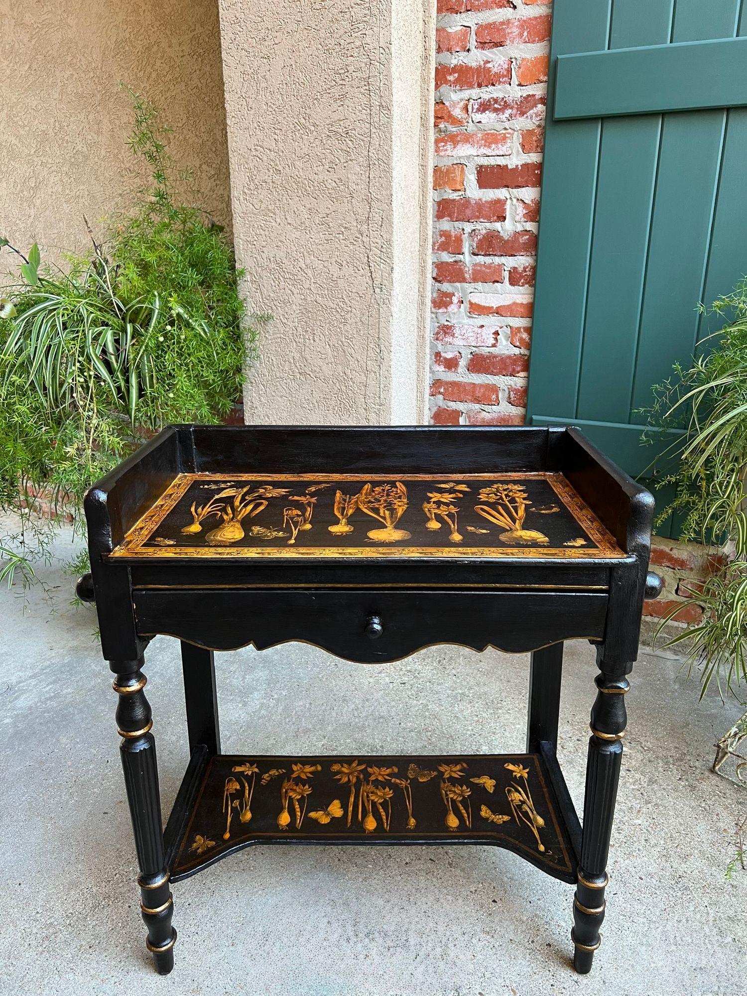 Antique English Sofa Side Table Decoupage Botanical Floral Black Gold c1890.

Direct from southern England, a superb one-of-a-kind antique English console or side table. This antique table was restored and recently decoupaged with a stunning