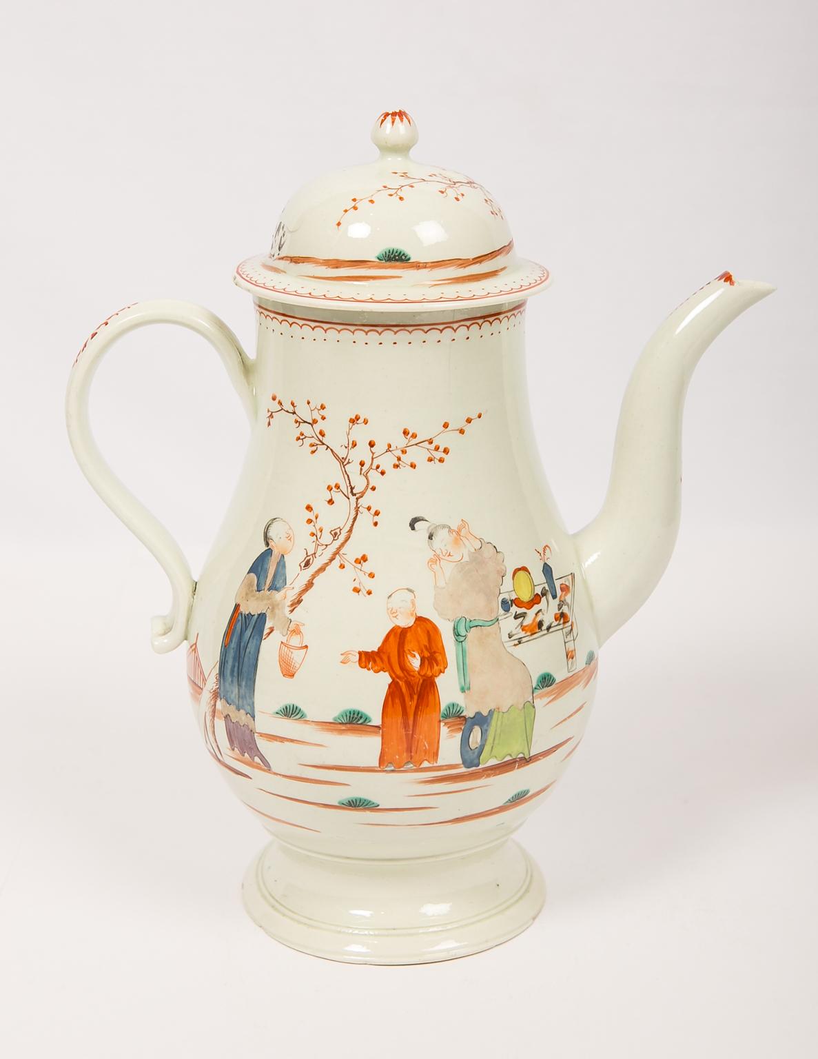 We are pleased to offer this rare Liverpool soft-paste porcelain coffee pot made in England in the late 18th century, circa 1785. 
The pot is painted with a lovely chinoiserie scene on both sides of the body. In the scene, a lady stands in front of