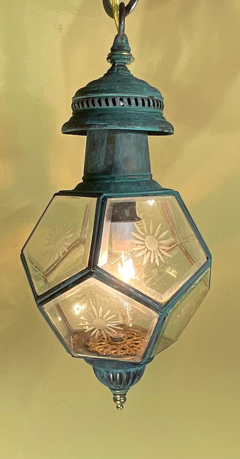 Step back in time with One Of A Kind  exquisite antique light fixture, a truly unique piece with a rich history. Originally crafted as a classic wall lantern, this solid brass pendant has been beautifully converted to a stunning hanging light,