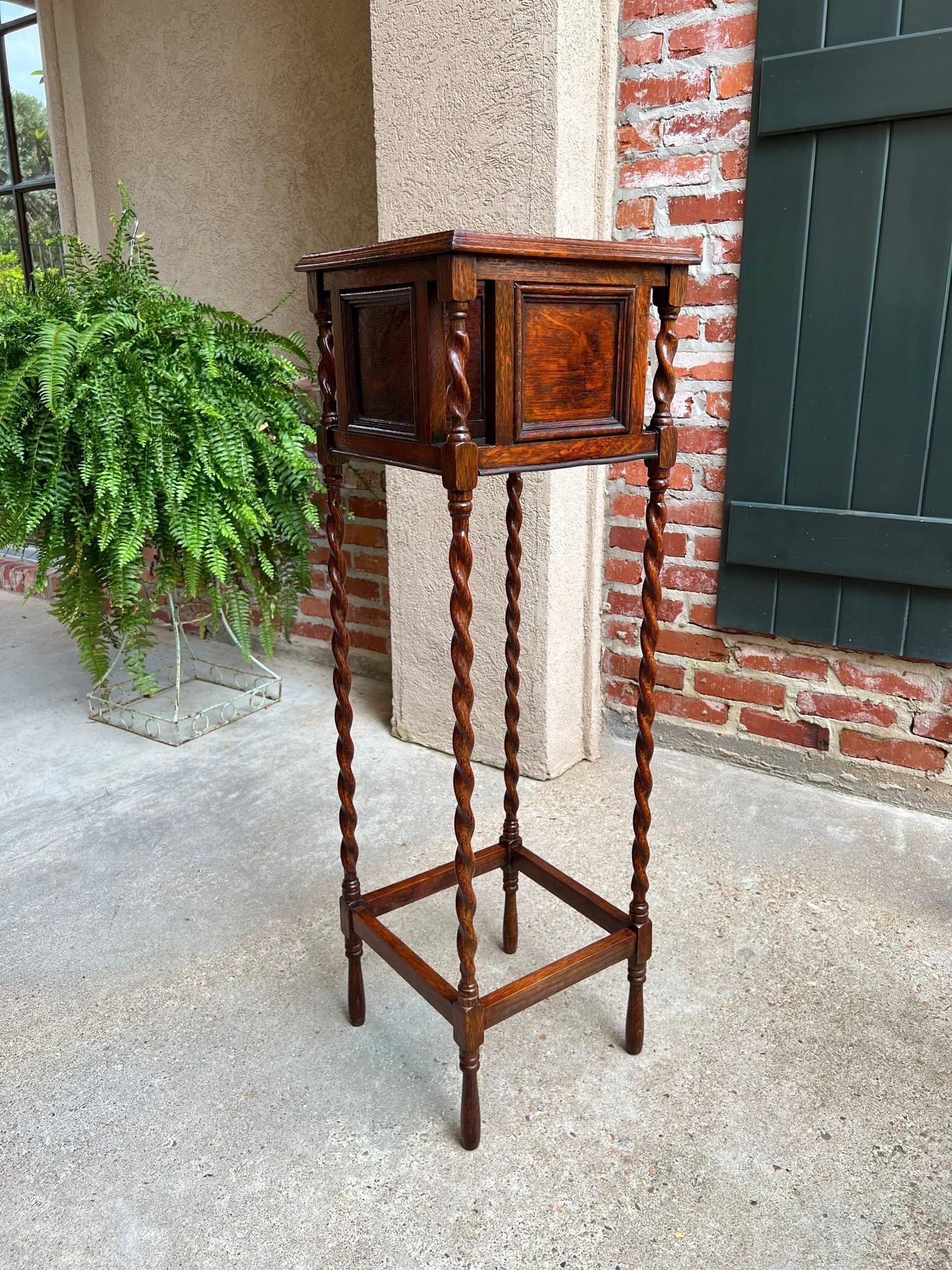 Antique English Square Plant Stand Barley Twist Tiger Oak Jardiniere Display.

Direct from England, a very tall and quite lovely antique English plant or display stand. Paneled square upper box has barley twists posts on each corner and includes the