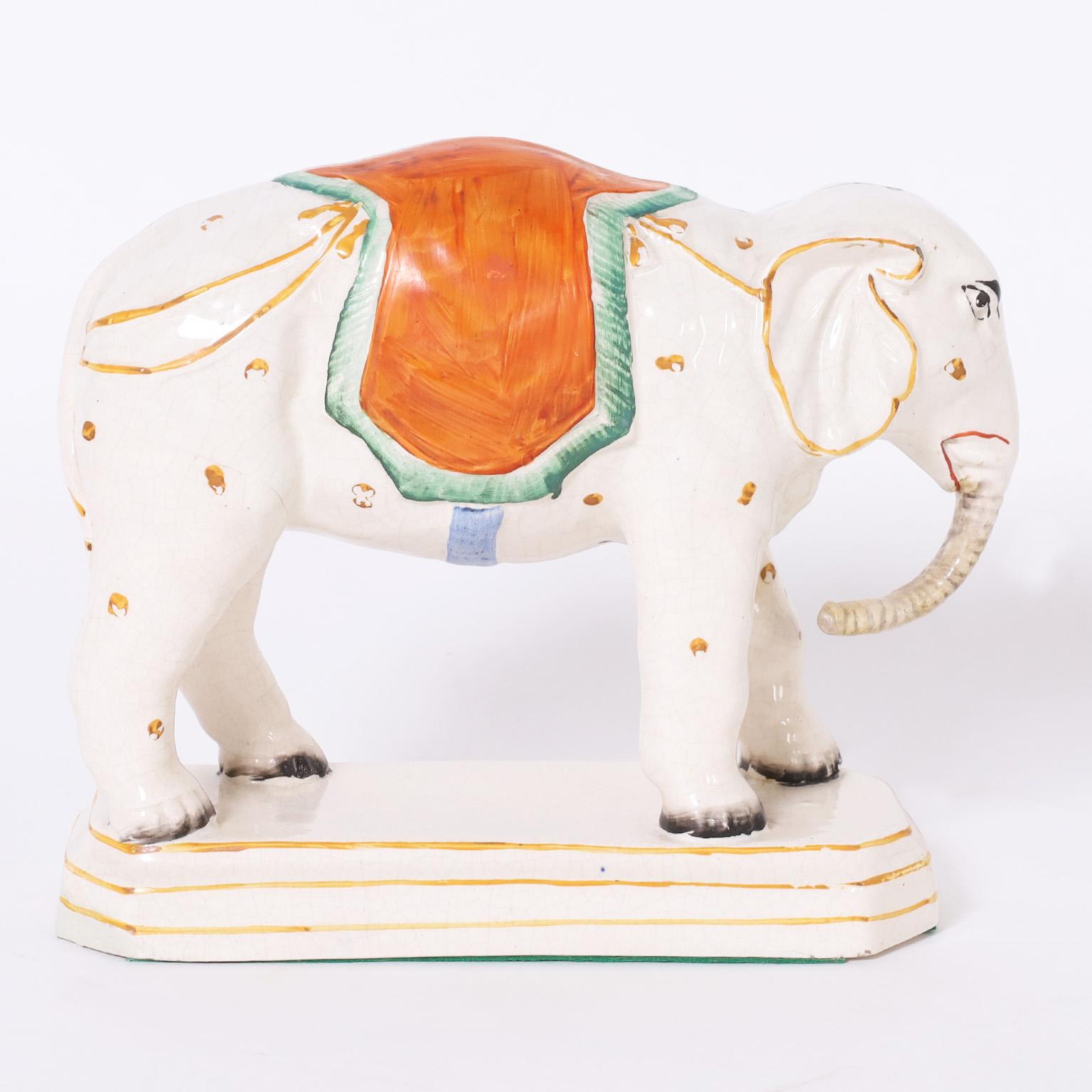 19th century English Staffordshire elephant crafted in ceramic, decorated and glazed now slightly crackled.