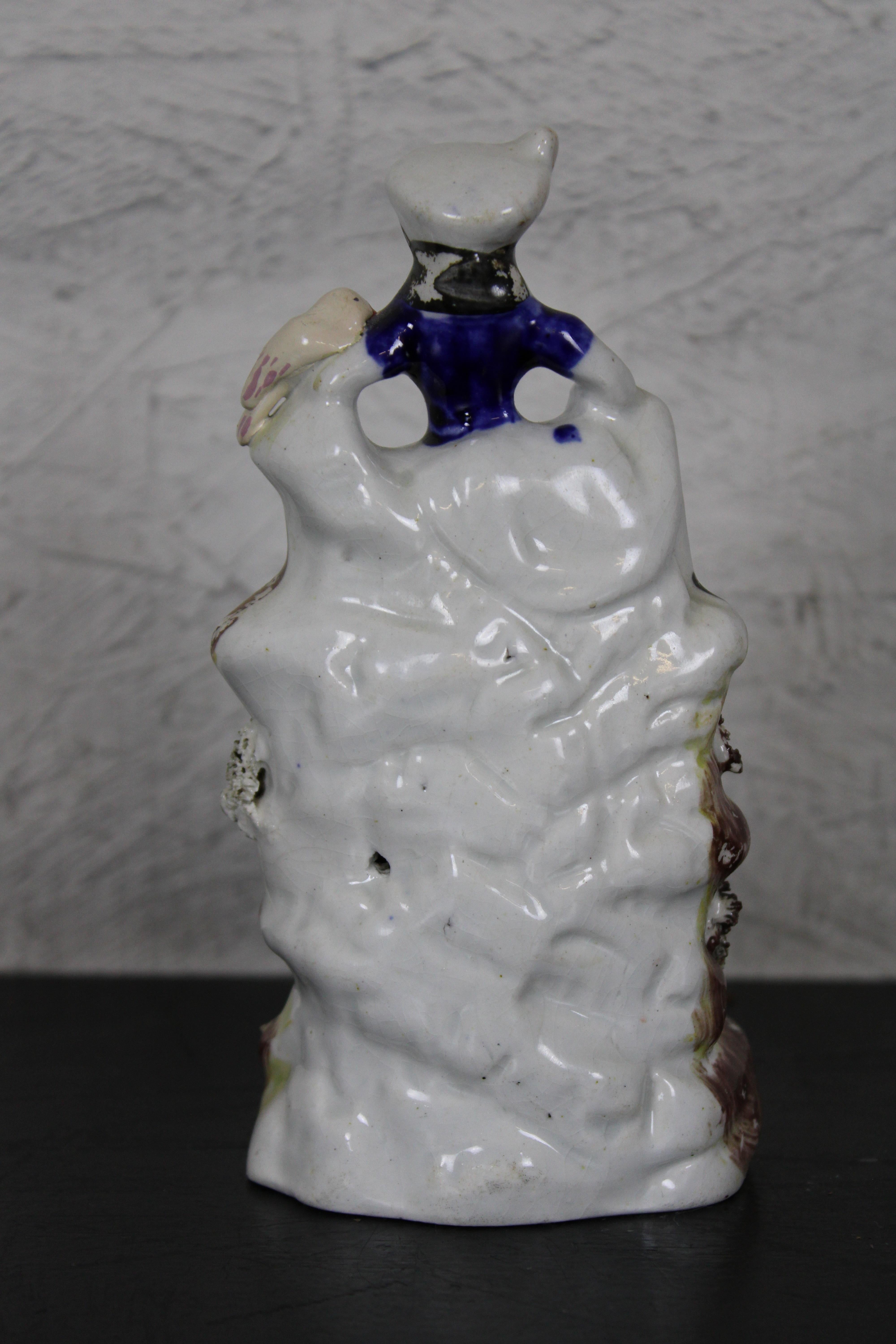 Antique English Staffordshire Porcelain Figurine Girl Seated on Waterfall Bird In Good Condition For Sale In Dayton, OH