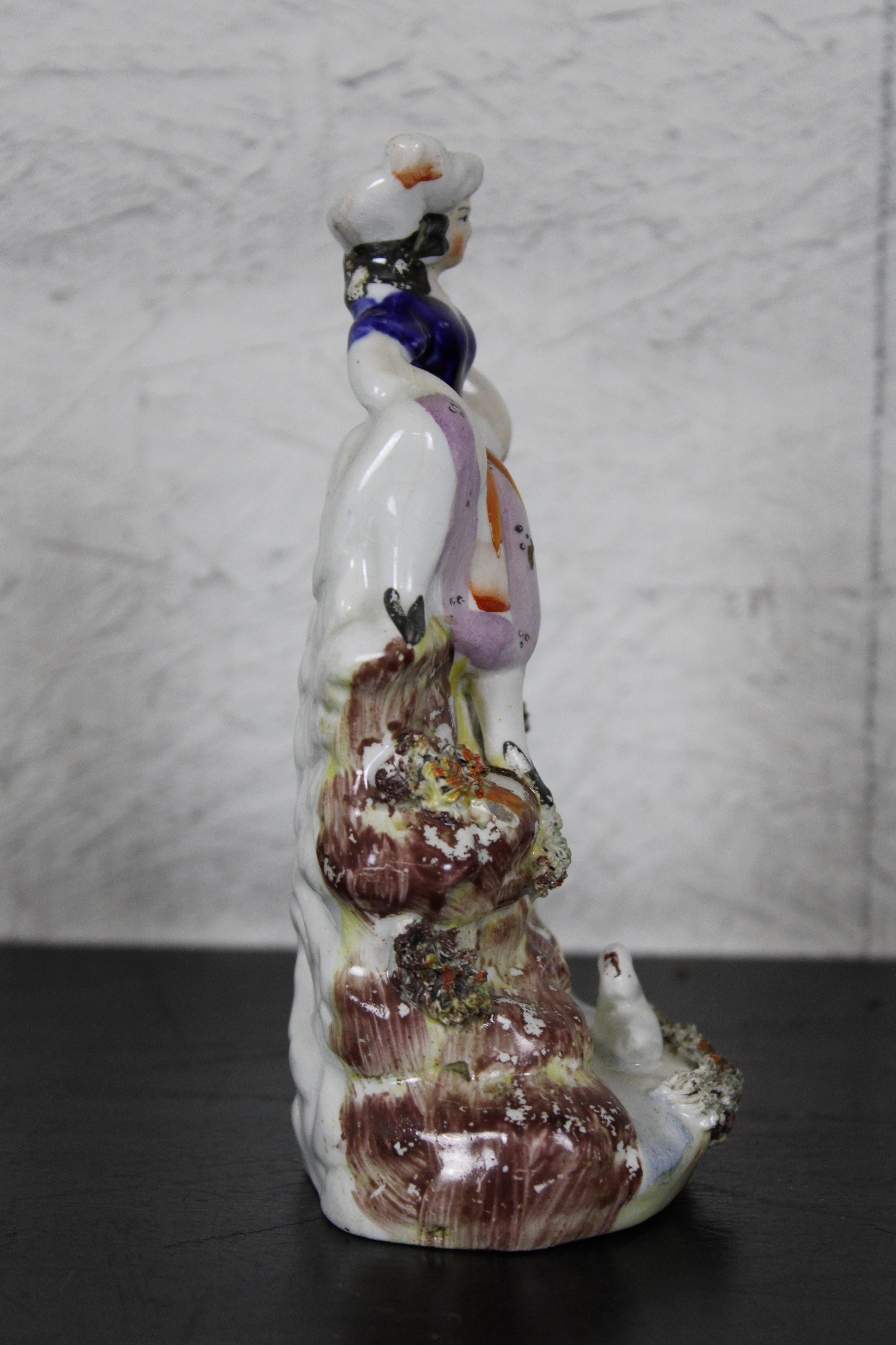 19th Century Antique English Staffordshire Porcelain Figurine Girl Seated on Waterfall Bird For Sale