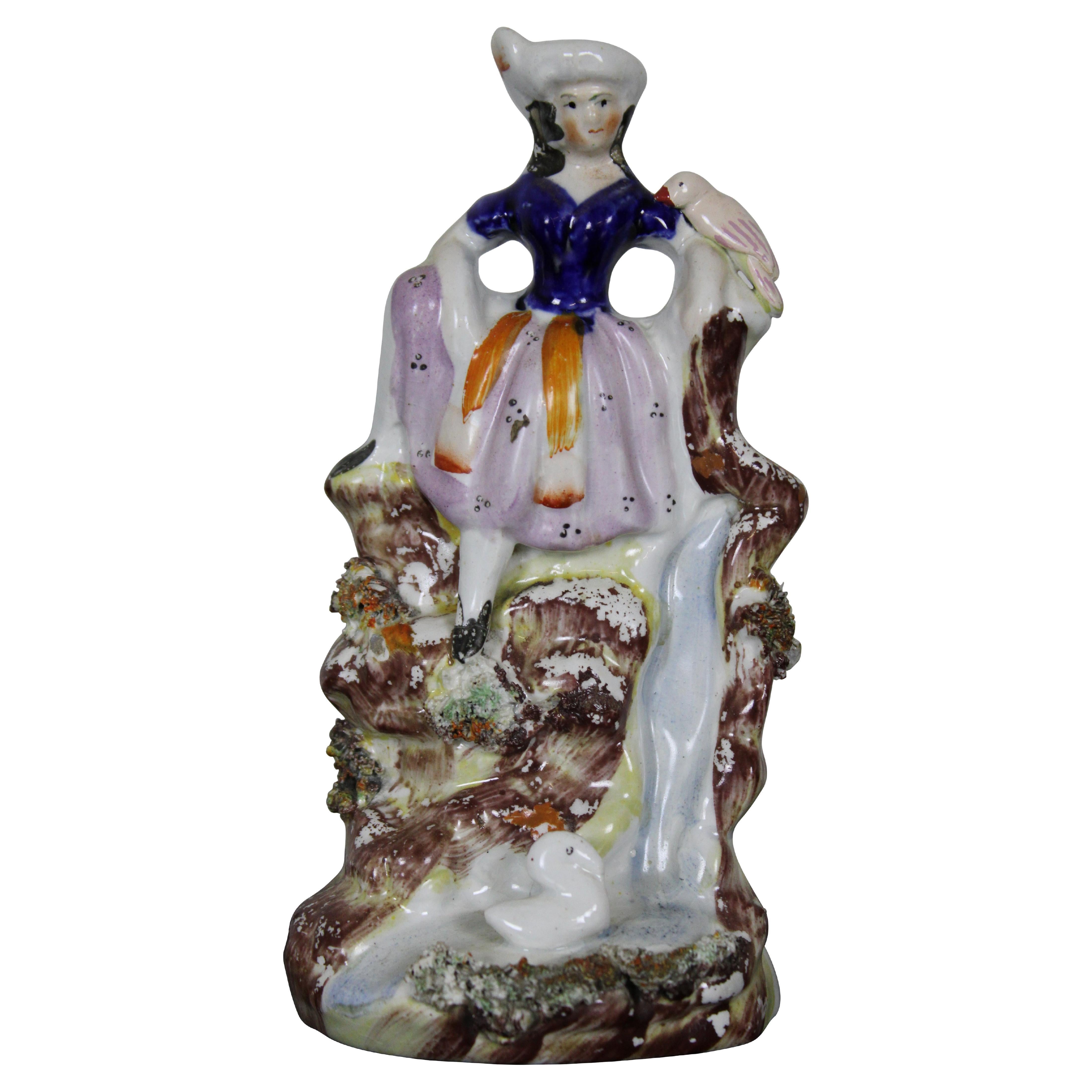 Antique English Staffordshire Porcelain Figurine Girl Seated on Waterfall Bird For Sale