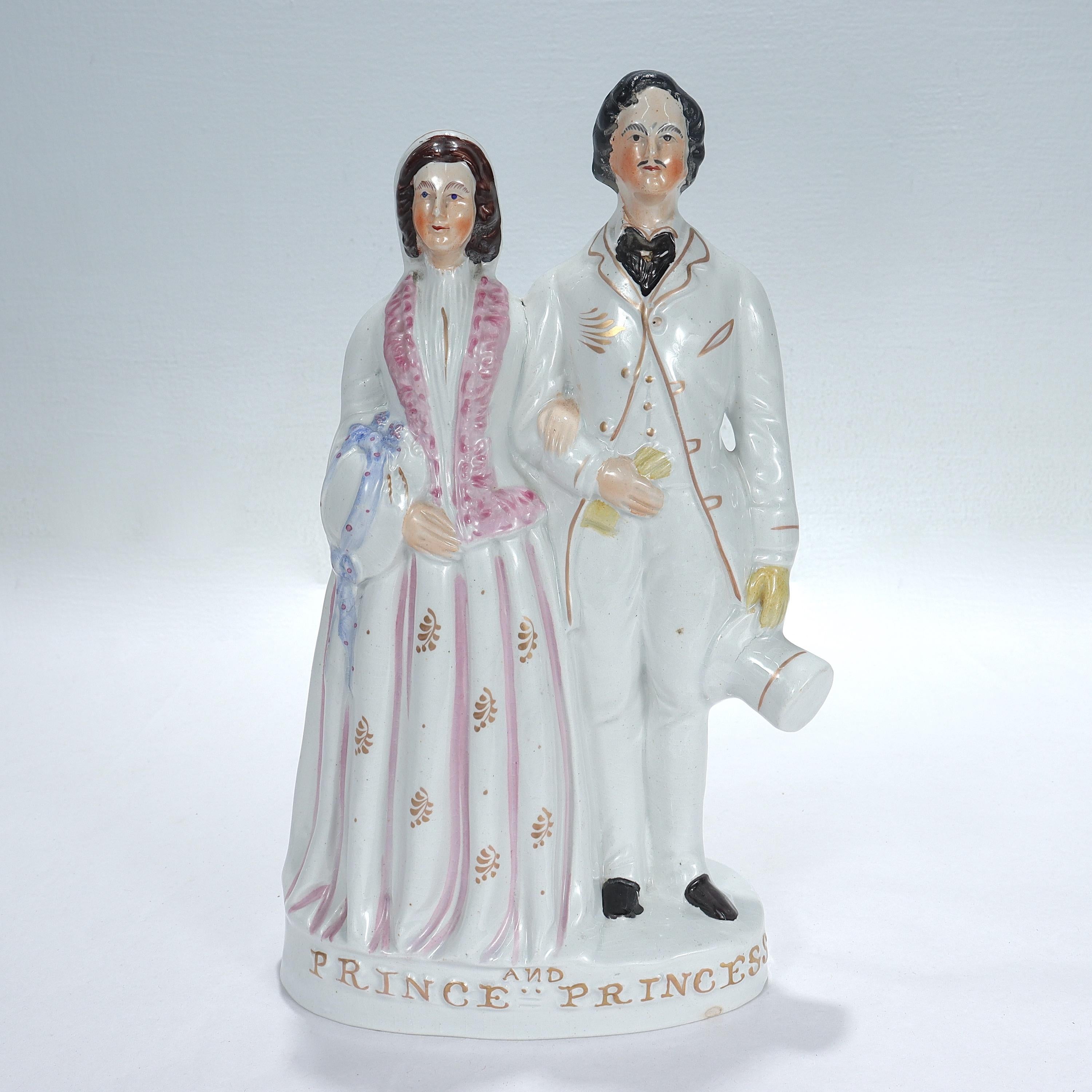 A fine antique Staffordshire pottery figurine.

Depicting Princess Alexandra of Denmark and Albert Edward, the Prince of Wales.

The two were married in 1863.

The royal figures stand atop a plinth that reads 