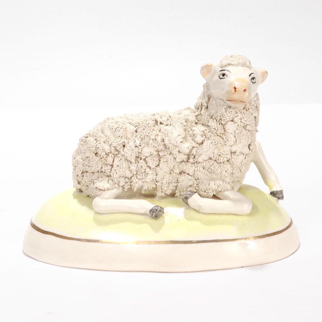 A fine English Staffordshire pottery figurine.

In the form of a sheep or lamb.

On an unusual oval, convex plinth.

Decorated with confetti fur.

Simply a wonderful Staffordshire figurine!

Date:
Late 19th Century

Overall Condition:
It is in